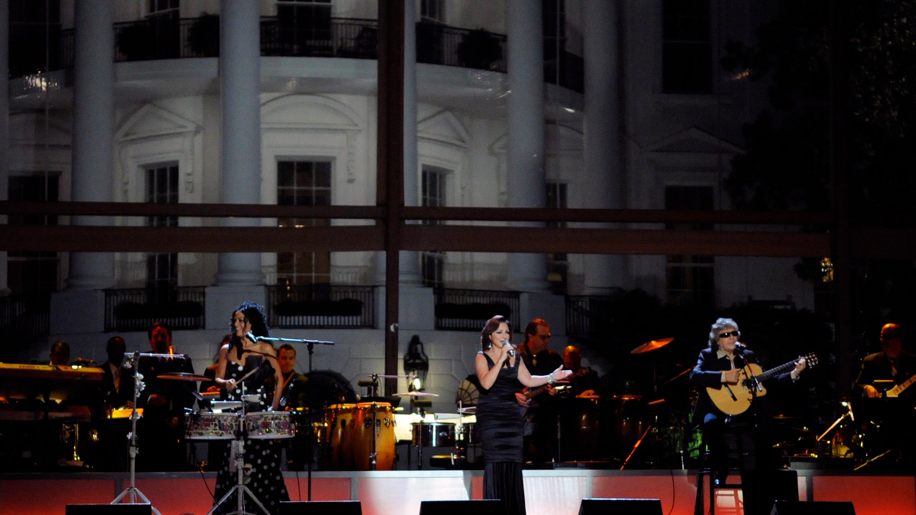 WASHINGTON - OCTOBER 13: (L-R) Sheila E., Gloria Estefan and Jose Feliciano perform at the White House music series "Fiesta Latina" on the South Lawn of the White House October 13, 2009 in Washington, DC. Salsa and Spanish classical music was featured. (Photo by Alexis C. Glenn-Pool/Getty Images)