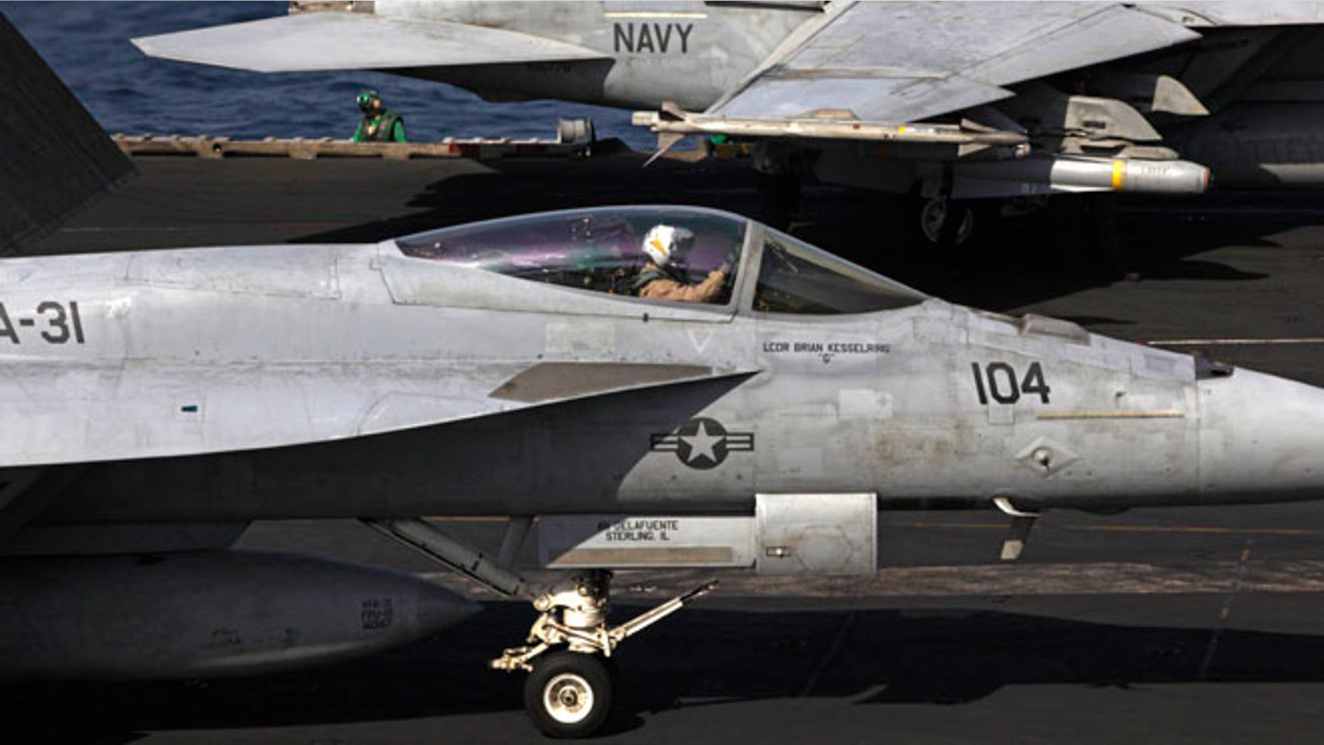 U.S. F/A-18 fighter jets prepare to take off for Iraq from the flight deck of the U.S. Navy aircraft carrier USS George H.W. Bush in the Persian Gulf, Monday, Aug. 11, 2014.