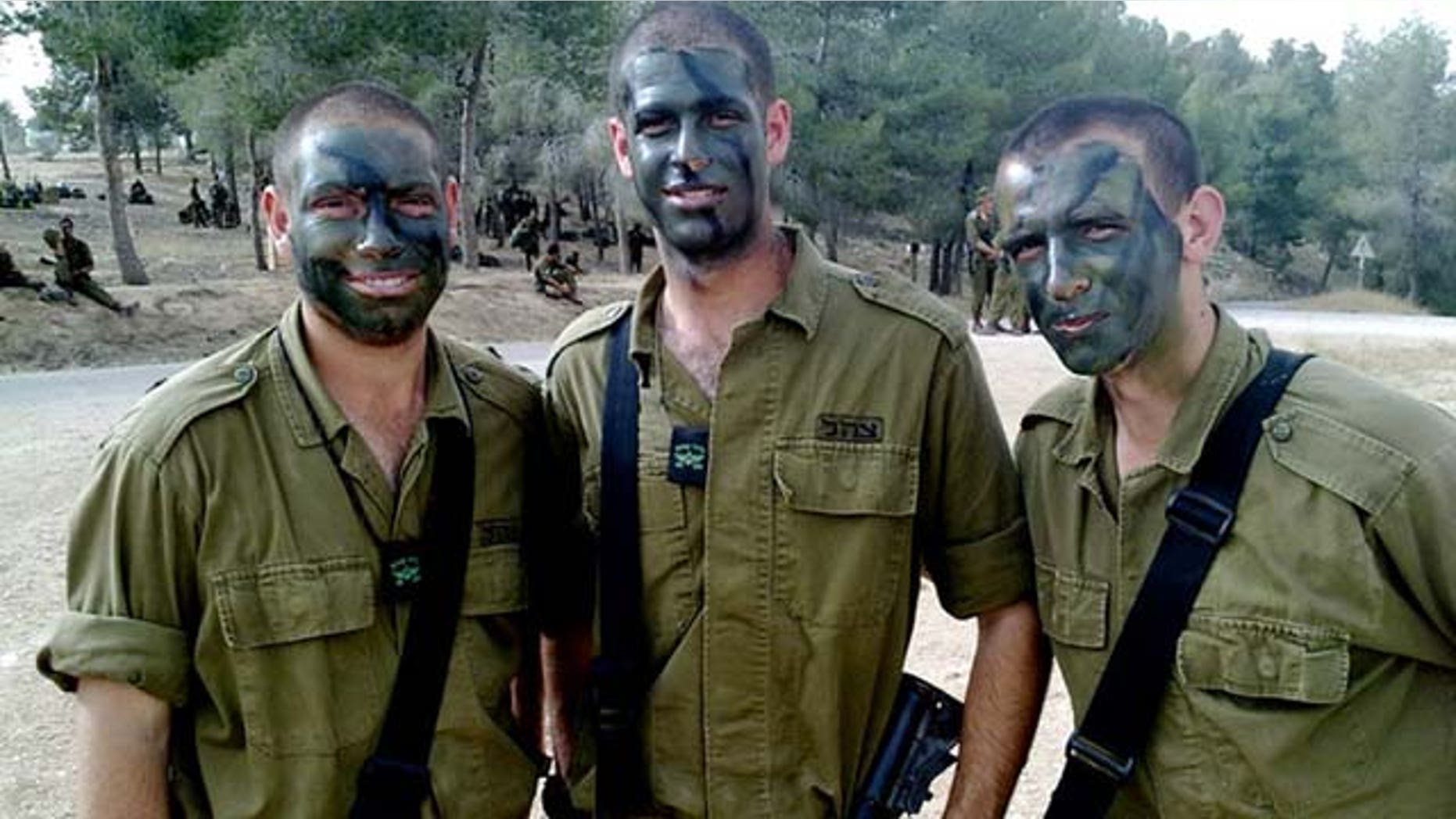 This March 2010 photo provided by Mike Fishbein shows Fishbein, middle, a U.S.-born soldier from Los Angeles, with fellow Americans David Wisefield, left, and Ilan Benjamin, all fighting for the Israel Defense Forces. (AP Photo/Courtesy Mike Fishbein)