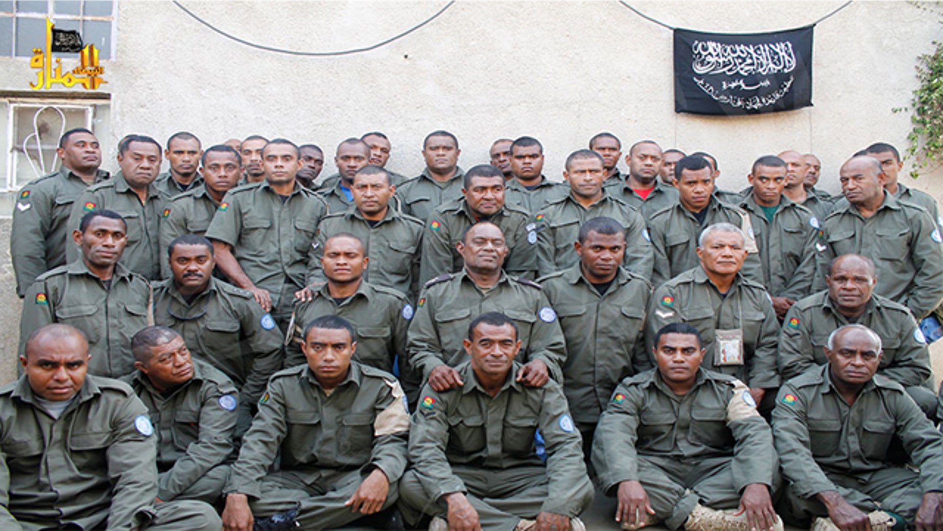 FILE - This undated file image attached to a statement released on Saturday, Aug. 30, 2014 on the Hanin Network website, a militant website, shows Fijian UN peacekeepers who were seized by The Nusra Front on Thursday, Aug. 28, 2014, in the Golan Heights in the buffer zone between Syria and Israel. (AP Photo/Hanin Network Website, File)