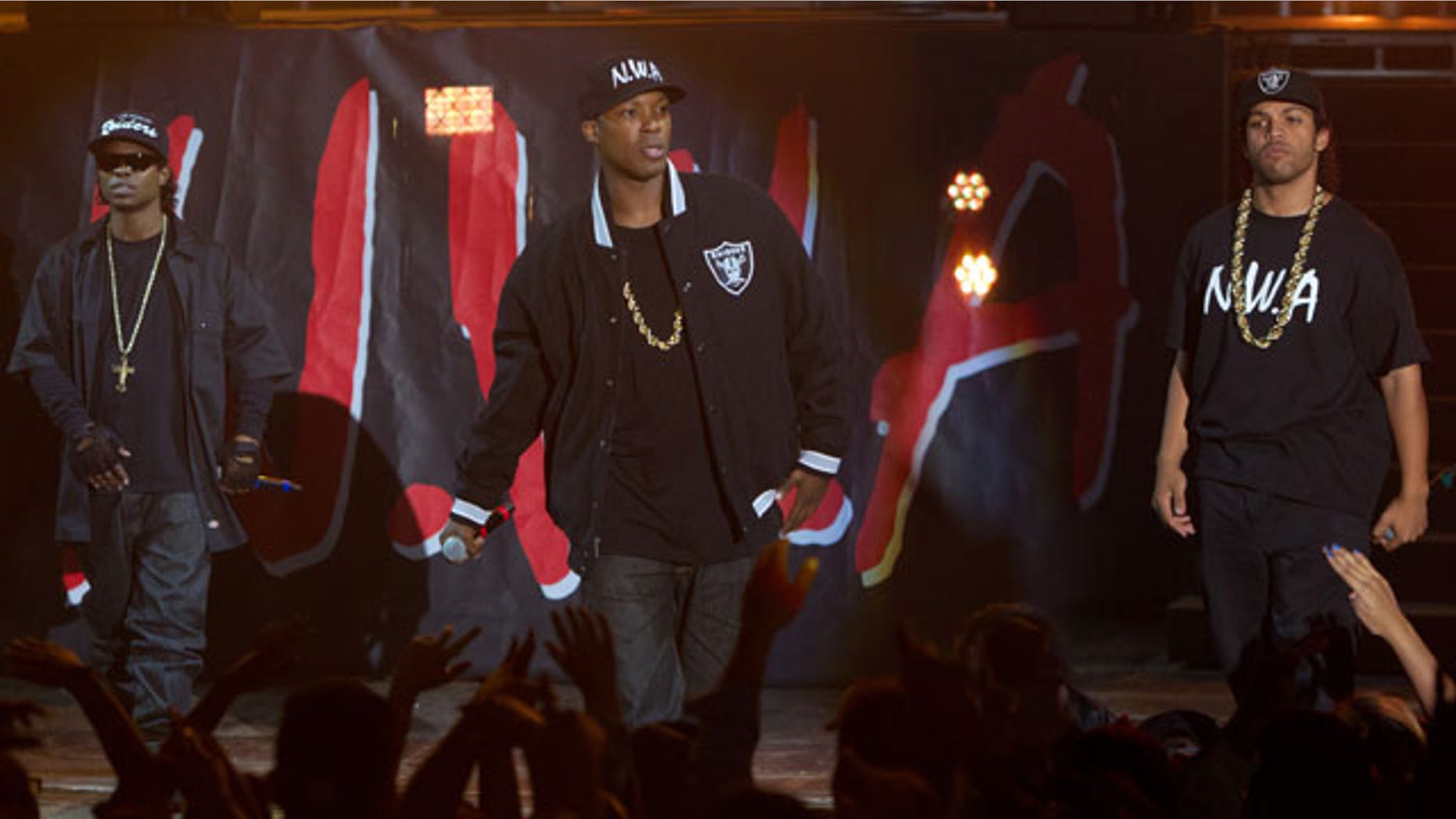 This photo provided by Universal Pictures shows, Jason Mitchell, from left, as Eazy-E, Corey Hawkins as Dr. Dre, and OShea Jackson, Jr. as Ice Cube, in the film 'Straight Outta Compton.' (Jaimie Trueblood/Universal Pictures via AP)