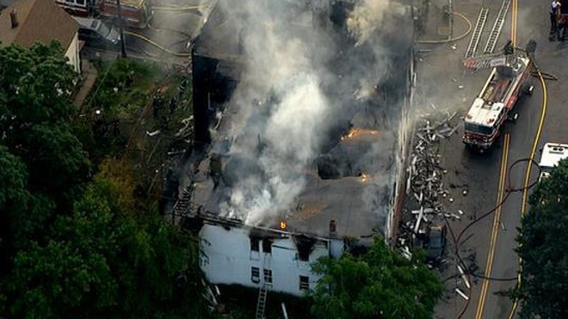 Authorities say seven people died early Thursday morning in a fire at a residential building in Lowell. Witnesses described a chaotic scene.