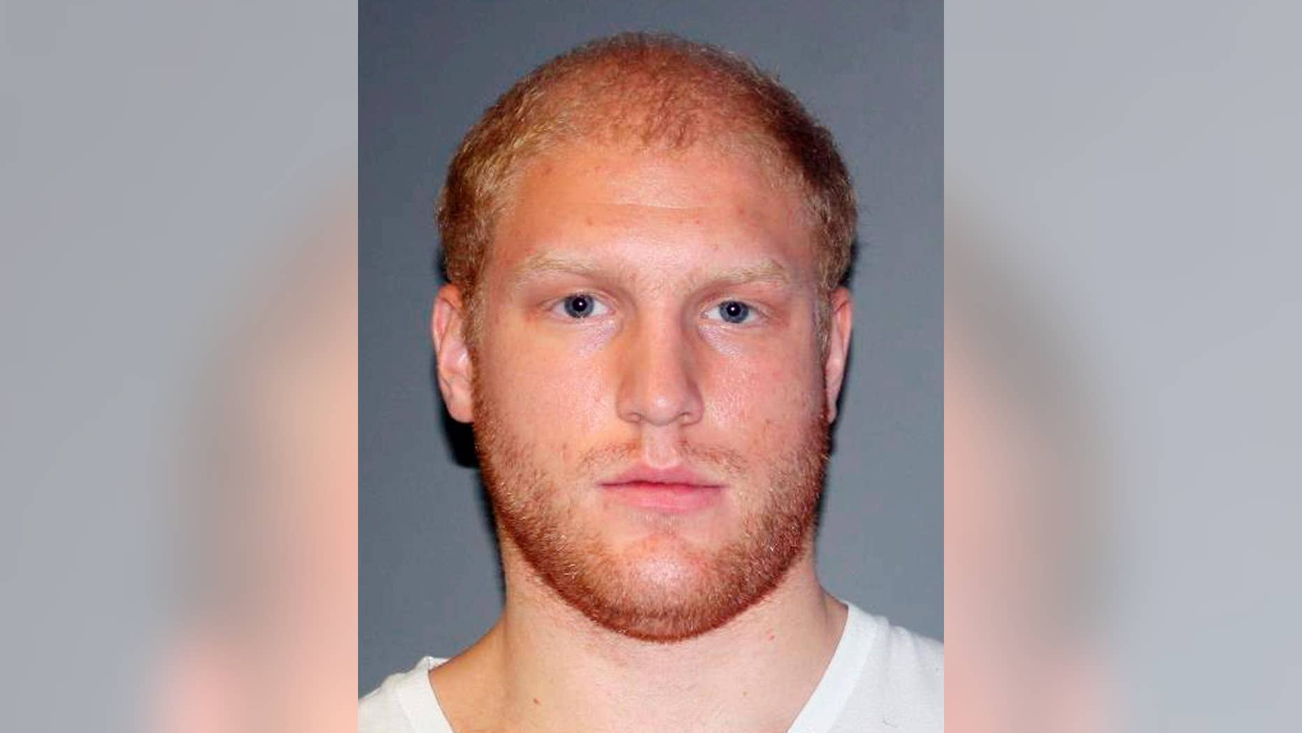 This photo provided Thursday, Sept. 10, 2015 by the Lansing, Mich., Police Department shows Grant Taylor, 22, of Lansing, Mich. Taylor was charged with murder Thursday in the hit-and-run death of a Michigan firefighter who authorities say was deliberately struck by Tayor's pickup truck as he collected money for charity. (Lansing Police Department via AP)
