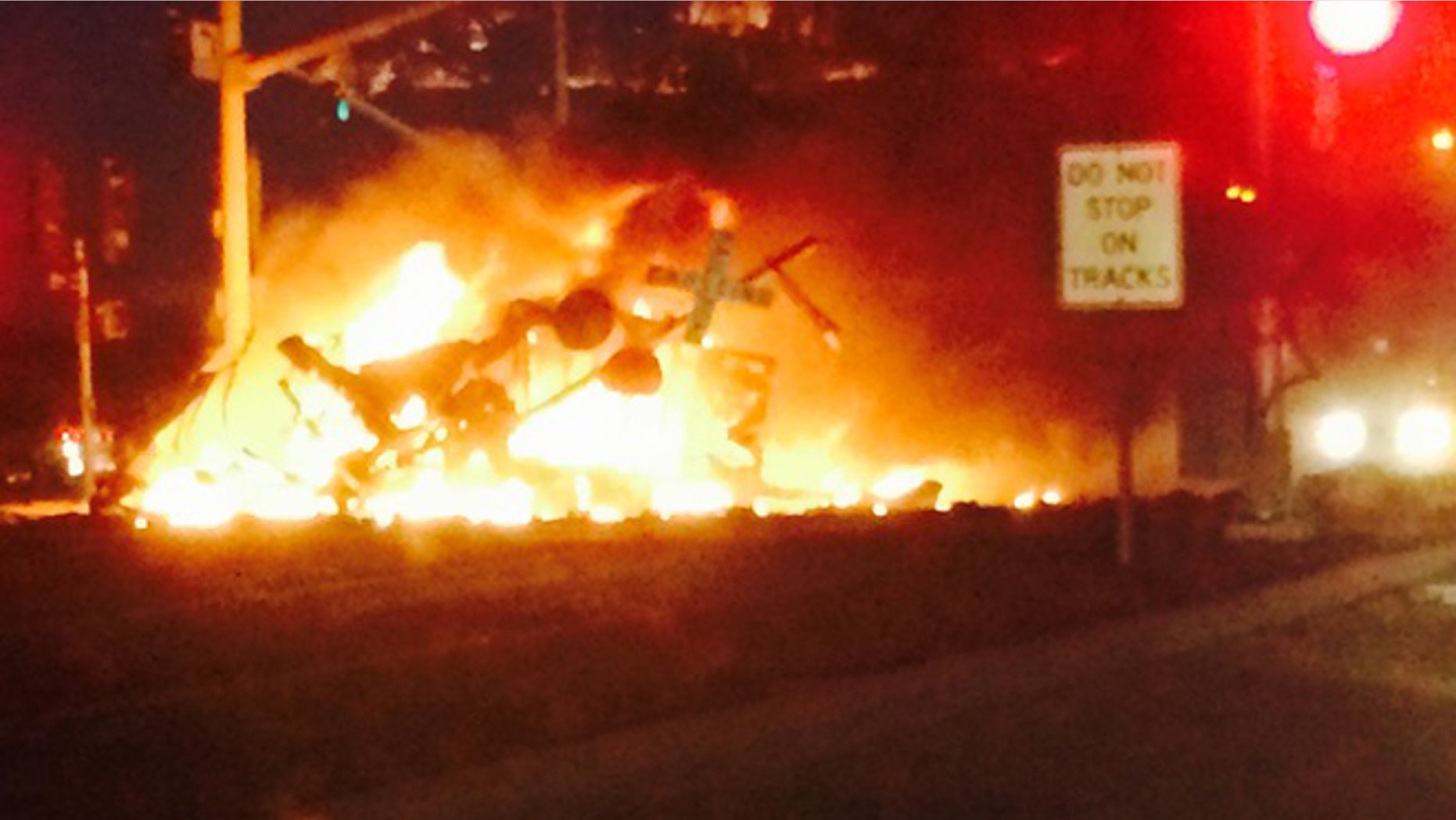 A commuter train crashed into a truck and derailed Tuesday, injuring dozens of people in farmland northwest of Los Angeles.