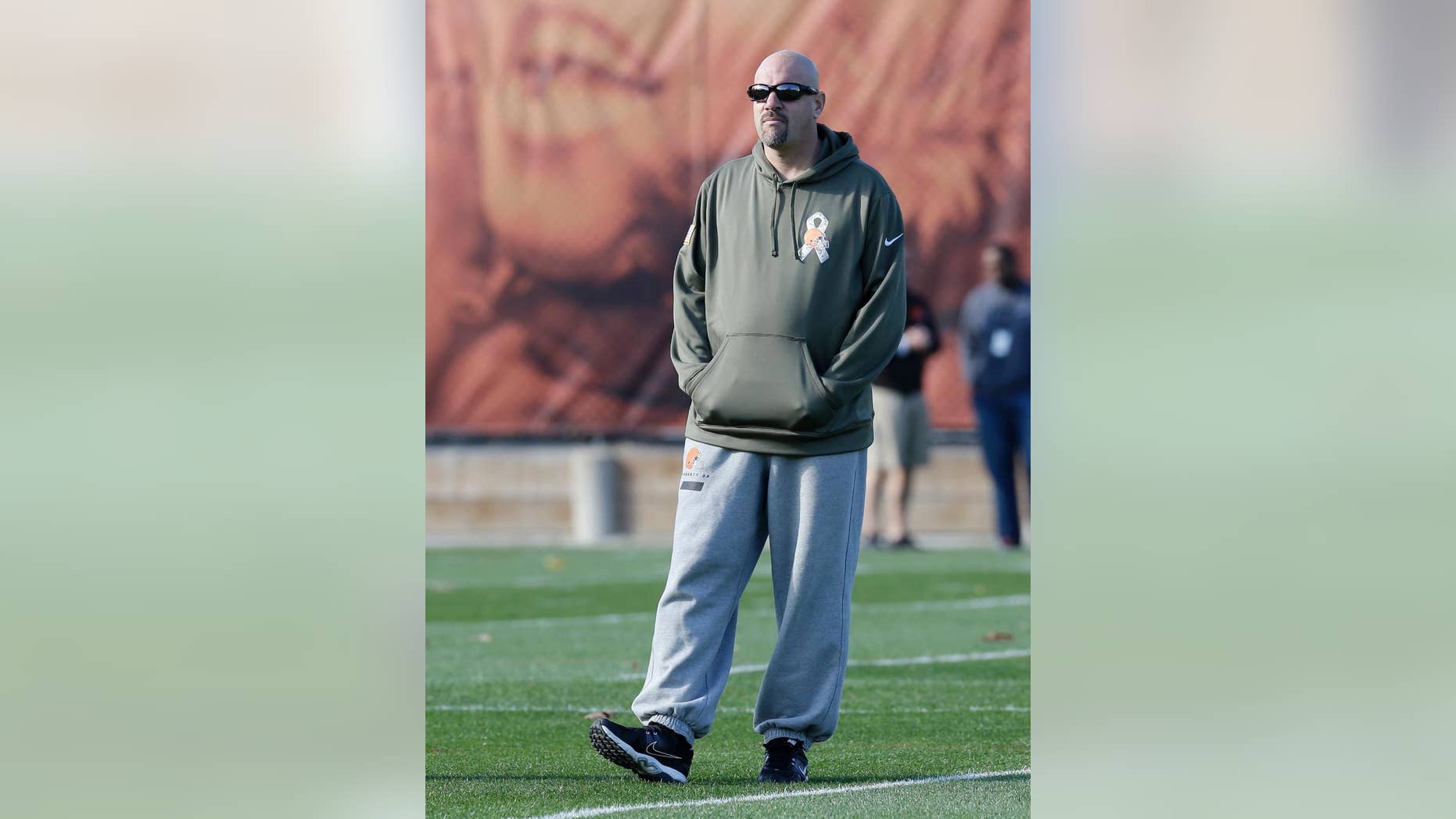 Cleveland Browns head coach Mike Pettine watches practice at the NFL football team's training camp Tuesday, Nov. 11, 2014, in Berea, Ohio. The Browns took an unexpected trip over their long weekend, into first place in the AFC North. Cleveland is alone atop the division for the first time since 1994, when starting quarterback Brian Hoyer was a 9-year-old kid dreaming of one day throwing touchdowns for his hometown team. (AP Photo/Tony Dejak)