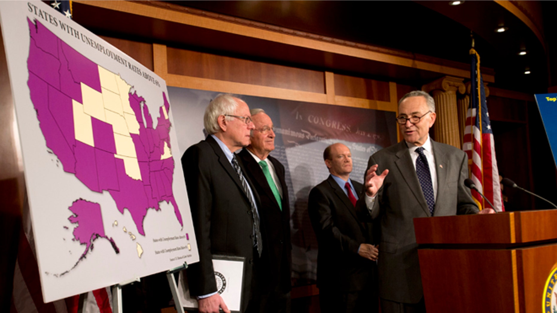 FILE- In this Dec. 6, 2012, photo, Sen. Charles Schumer, D-N.Y., right, accompanied by from left, Sen. Bernard Sanders, I-Vt., Sen. Tom Harkin, D-Iowa, and Sen. Chris Coons, D-Del., gestures during a news conference the possibility of Americans abruptly their jobless benefits at the of the year on Capitol Hill in Washington, Hovering in the background of the "fiscal cliff" debate is the prospect of 2 million people losing their unemployment benefits four days after Christmas. (AP Photo/Jacquelyn Martin)