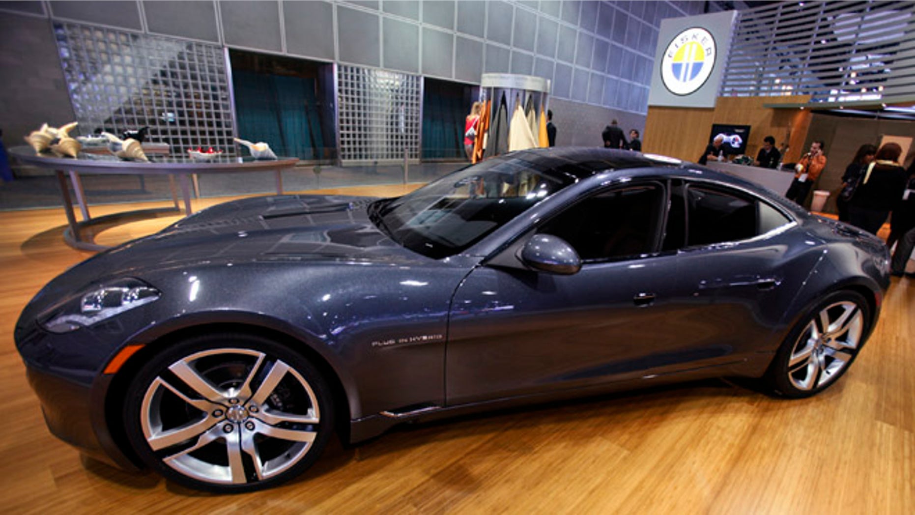 FILE: Nov. 18, 2010: In this file photo, Fisker Automotive's Fisker Karma, a sports luxury plug-in hybrid car, sits on display at the 2010 Los Angeles Auto Show in Los Angeles.