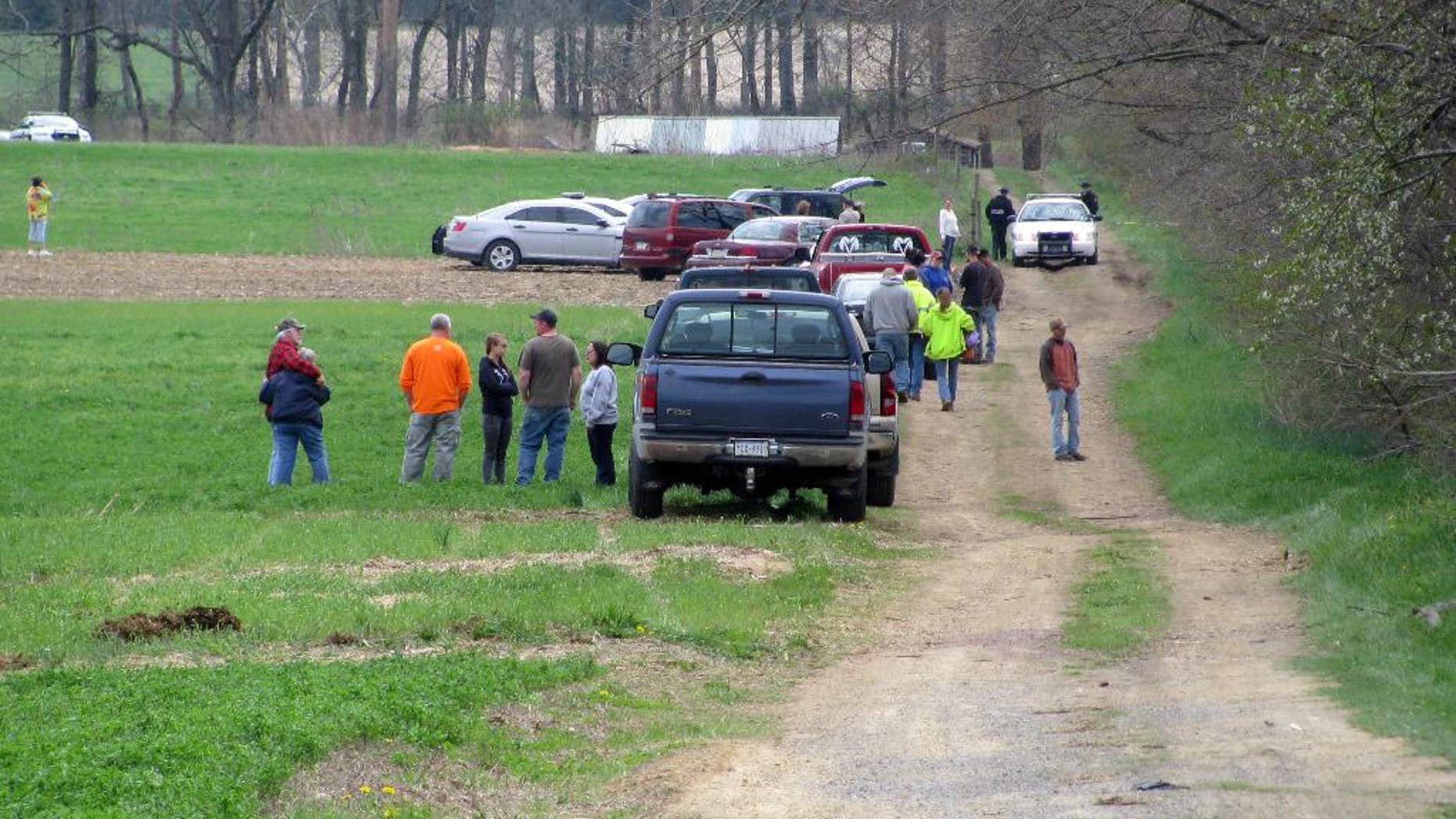 This was the scene Saturday, May 3, 2014, as state police notified the families of two adults and three children who were found dead in a cabin in rural Washington Township by a friend sometime in the late morning. State Police Capt. David Young said the preliminary investigation showed no signs of foul play and the cause of the deaths was not considered suspicious. But state police are looking at all possibilities, including carbon monoxide poisoning, he said. A propane heater was found inside the cabin. (AP Photo/Sun-Gazette, Nico Salvatori)