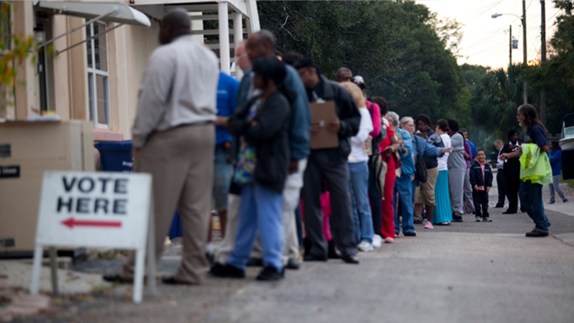 ST. PETERSBURG, FL - NOVEMBER 6: Lines of voters wait to cast their ballots as the polls open November 6, 2012 in St. Petersburg, Florida. The swing state of Florida is a hotly-contested battleground that offers 29 electoral votes. (Photo by Edward Linsmier/Getty Images)