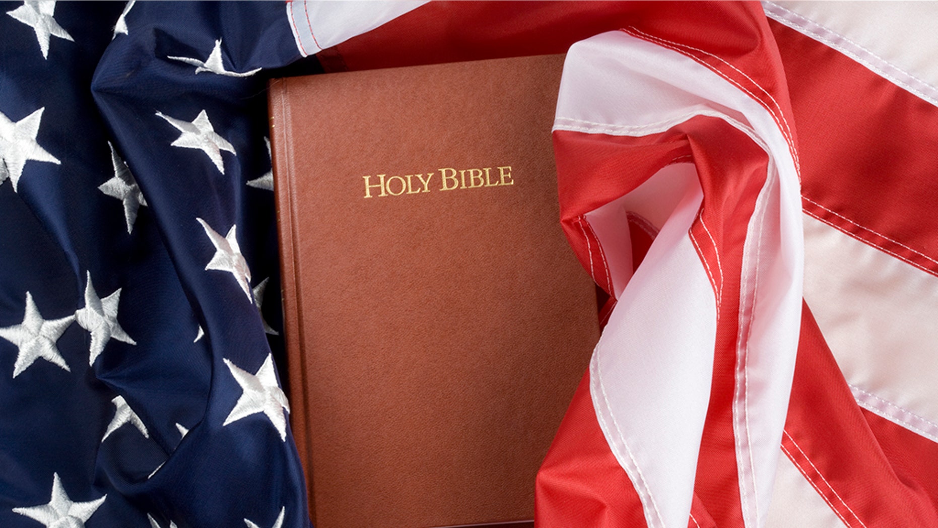 Holy bible in US flag. Close up.