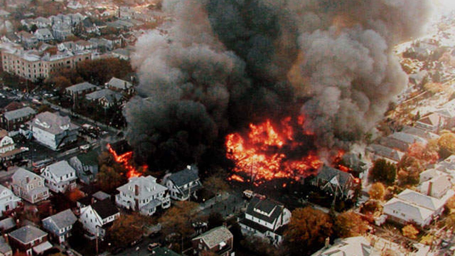 Nov. 12, 2001: Fires burning in New York's Belle Harbor neighborhood, from the crash of American Airlines Flight 587 which killed 265 people.