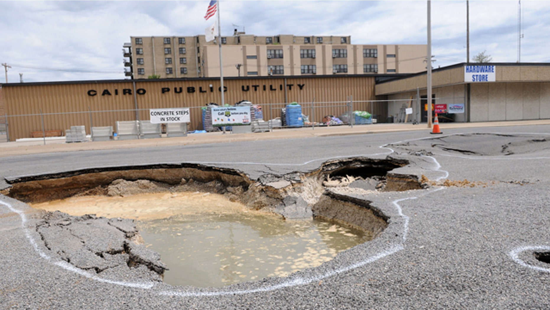 April 30: A sink hole from the Ohio River is seen on Commerce Avenue in Cairo, Ill. Mayor Judson Childs has issued a mandatory evacutation to residents.