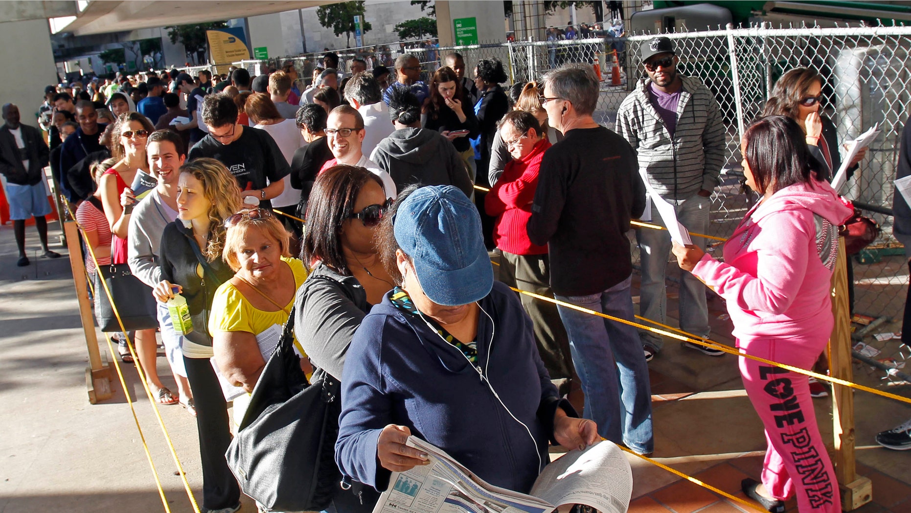 South Floridians stand in line during the last day of early voting in Miami, Saturday, Nov. 3, 2012. Despite record turnout in many parts of the state, Florida Gov. Rick Scott rejected calls to extend early voting through Sunday to help alleviate long lines at the polls. (AP Photo/Alan Diaz)