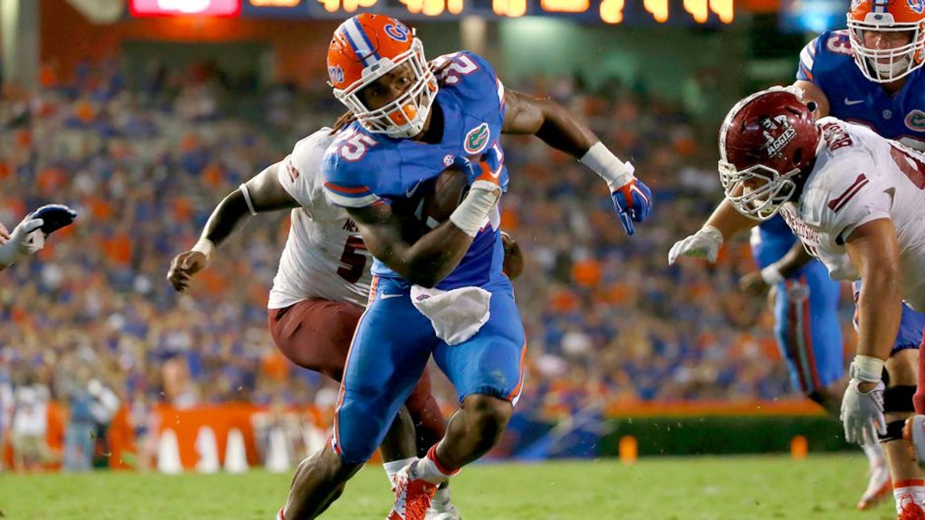Sep 5, 2015; Gainesville, FL, USA; Florida Gators running back Jordan Scarlett (25) runs the ball in for a touchdown against the New Mexico State Aggies during the second half at Ben Hill Griffin Stadium. Mandatory Credit: Kim Klement-USA TODAY Sports
