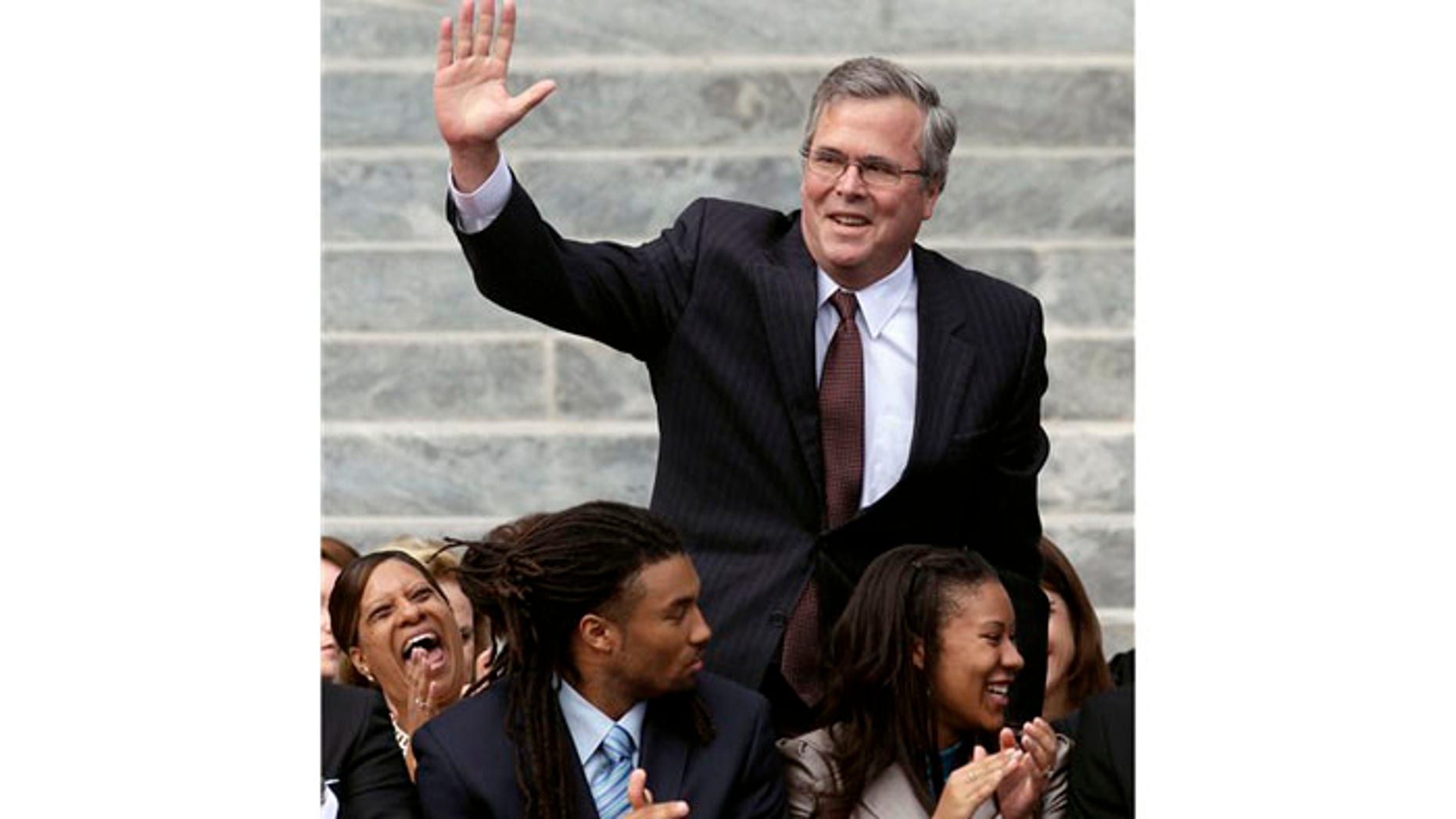 January 2011: Former Florida Gov. Jeb Bush waves as he is introduced to the crowd during inauguration ceremonies for Republican Gov. Rick Scott outside the Old Capitol in Tallahassee, FL.
