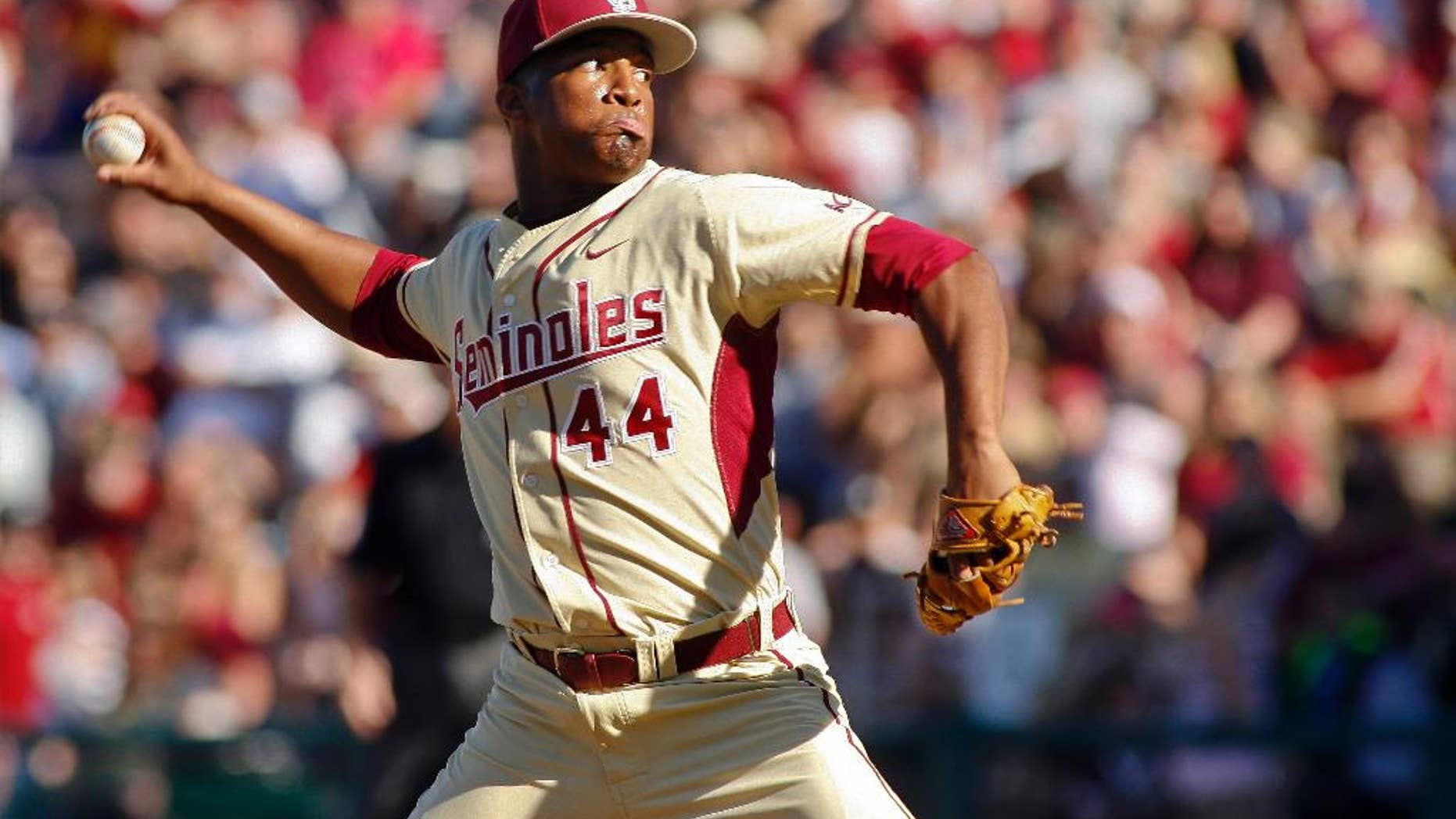 FILE - In this March 2, 2014, file photo, Florida State relief pitcher Jameis Winston throws in the ninth inning of an NCAA college baseball game against Miami in Tallahassee, Fla. Winston put together the best pitching outing of his collegiate baseball career in the Seminoles’ 13-inning win against North Carolina State on Saturday, March 15, 2014. (AP Photo/Phil Sears, File)
