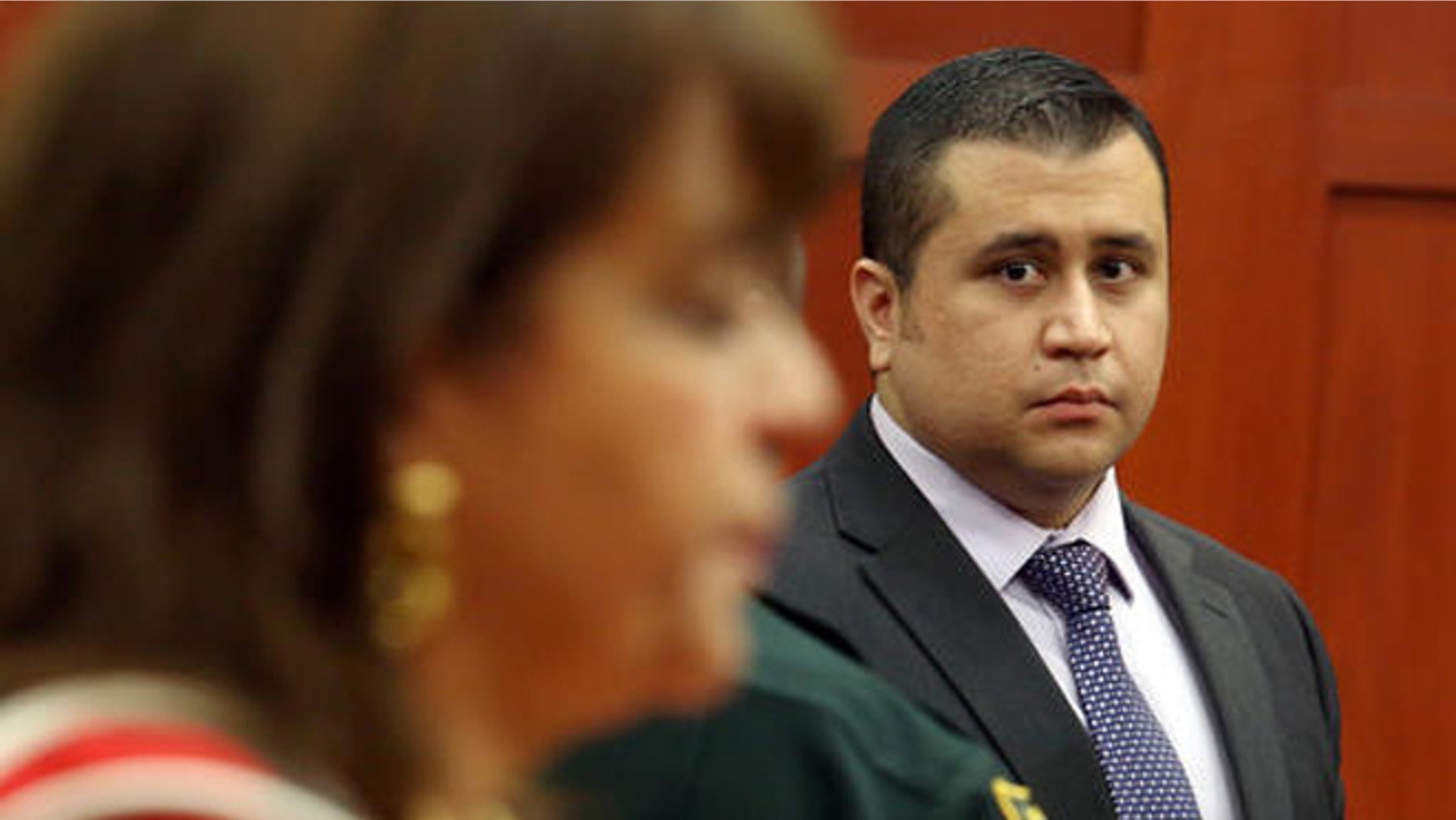 FILE- In this July 3, 2013, file photo, George Zimmerman looks at State Attorney Angela Corey during a recess in his trial at the Seminole County circuit court, in Sanford, Fla. Corey, the Florida prosecutor who failed to win a second-degree murder conviction against George Zimmerman after he shot Trayvon Martin, could lose her bid for re-election. Corey is up against two opponents in the Aug. 30, 2016, Republican primary for the state attorneys office. (AP Photo/Orlando Sentinel, Jacob Langston, Pool, File)