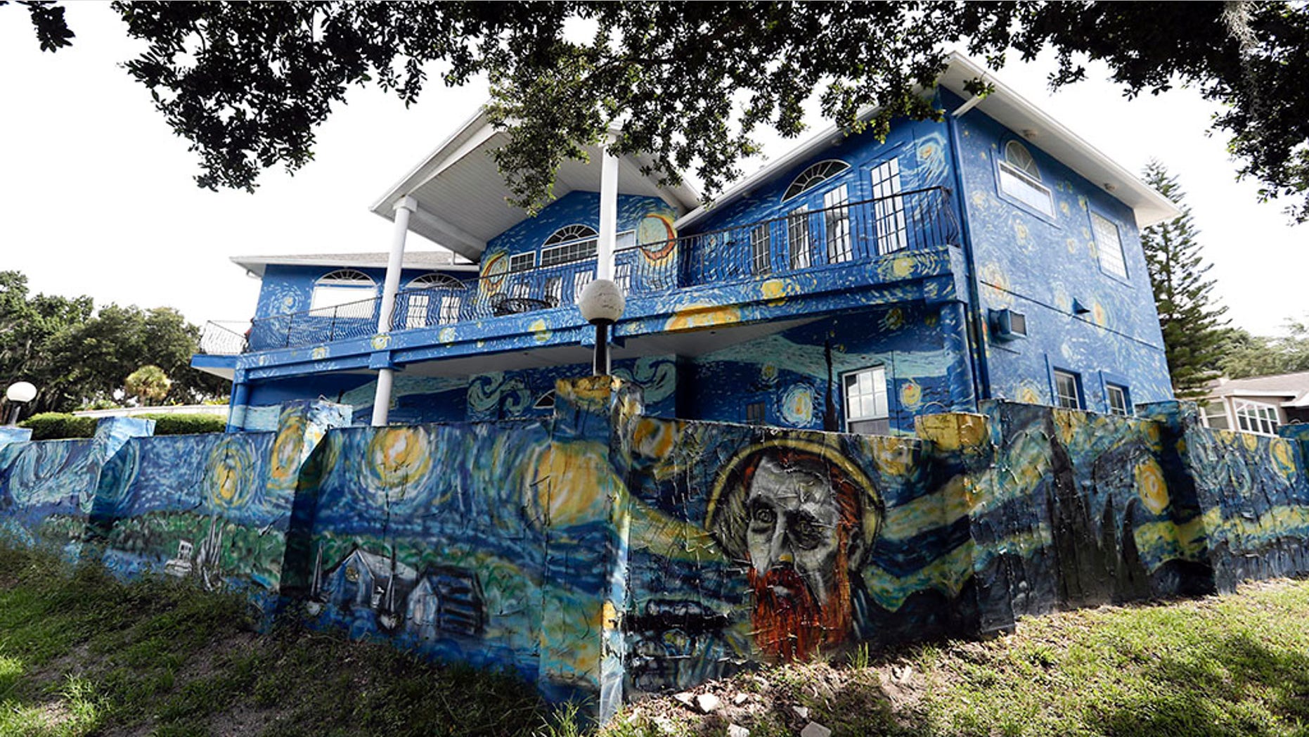 This Wednesday, July 18, 2018 photo shows the painted exterior of the home of Lubomir Jastrzebski and Nancy Nemhauseer in Mount Dora, Fla.