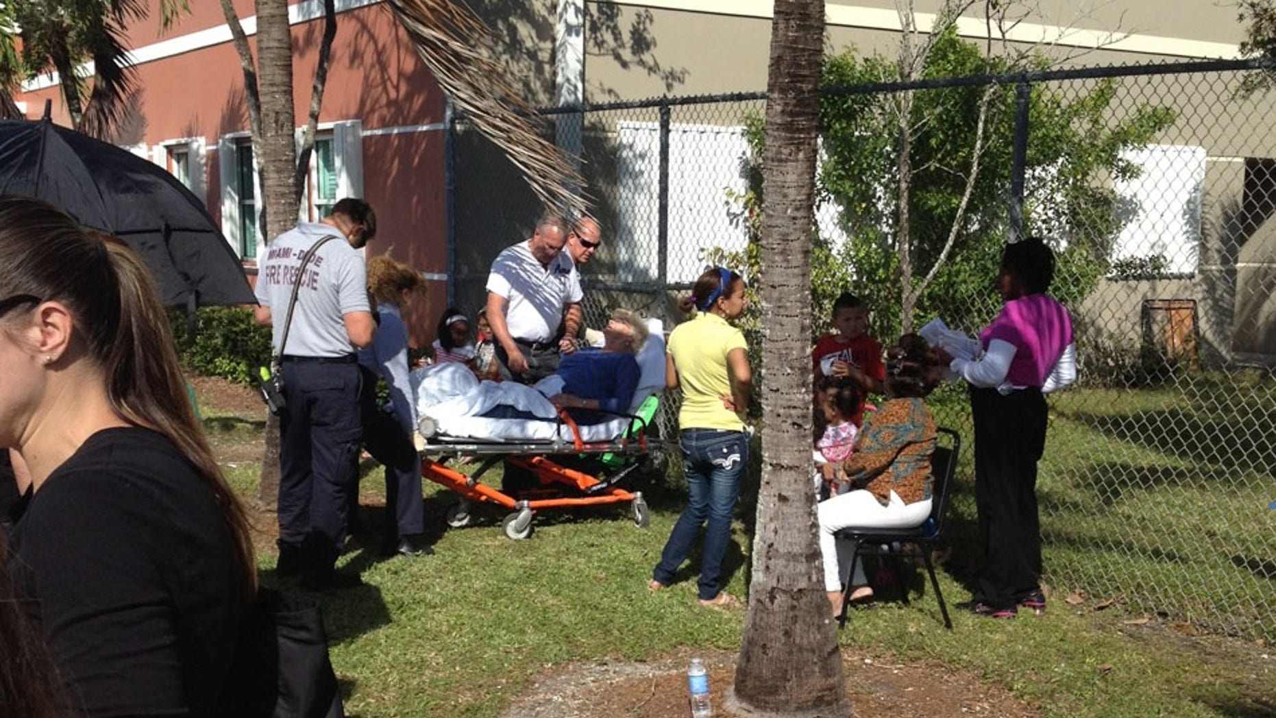 Tuesday, Nov. 6, 2012: A voter in the south Miami area appears to need medical assistance after waiting in 80-degree temperatures to vote.