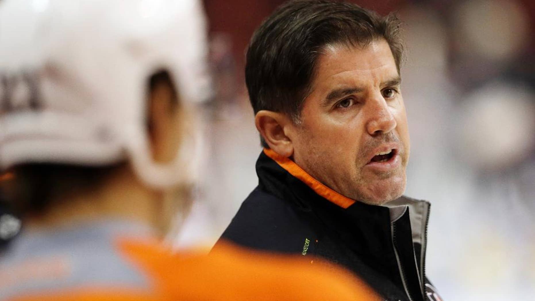 FILE - In this Sept. 12, 2013, file photo, Philadelphia Flyers head coach Peter Laviolette speaks to players during NHL hockey training camp in Philadelphia. The Nashville Predators hired the former Flyers' coach as their new coach on Tuesday, May 6, 2014, making him only the second head coach in the franchise’s history. Laviolette, who signed a multi-year contract, will take over in Nashville once he finishes coaching the United States at the 2014 World Championship. (AP Photo/Matt Rourke, File)