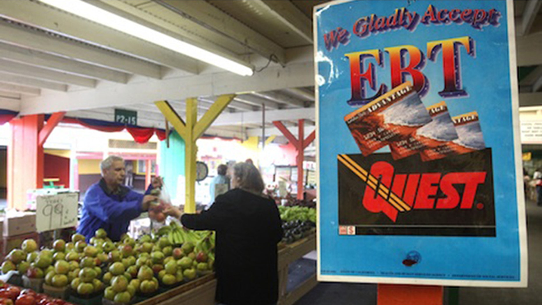 A sign announcing the acceptence of electronic Benefit Transfer cards is seen at the Denios Farmers market in Roseville, Calif., (AP Photo/Rich Pedroncelli)