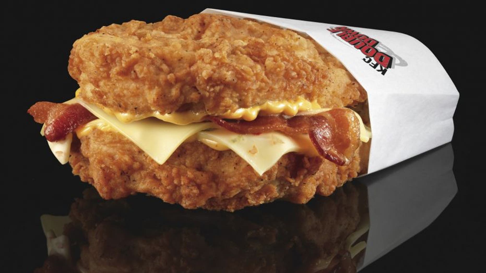 The Double Down is a sandwich with two chicken filets taking the place of bread slices. In between are two pieces of bacon, melted slices of Monterey Jack and Pepper Jack cheese and a zesty sauce.