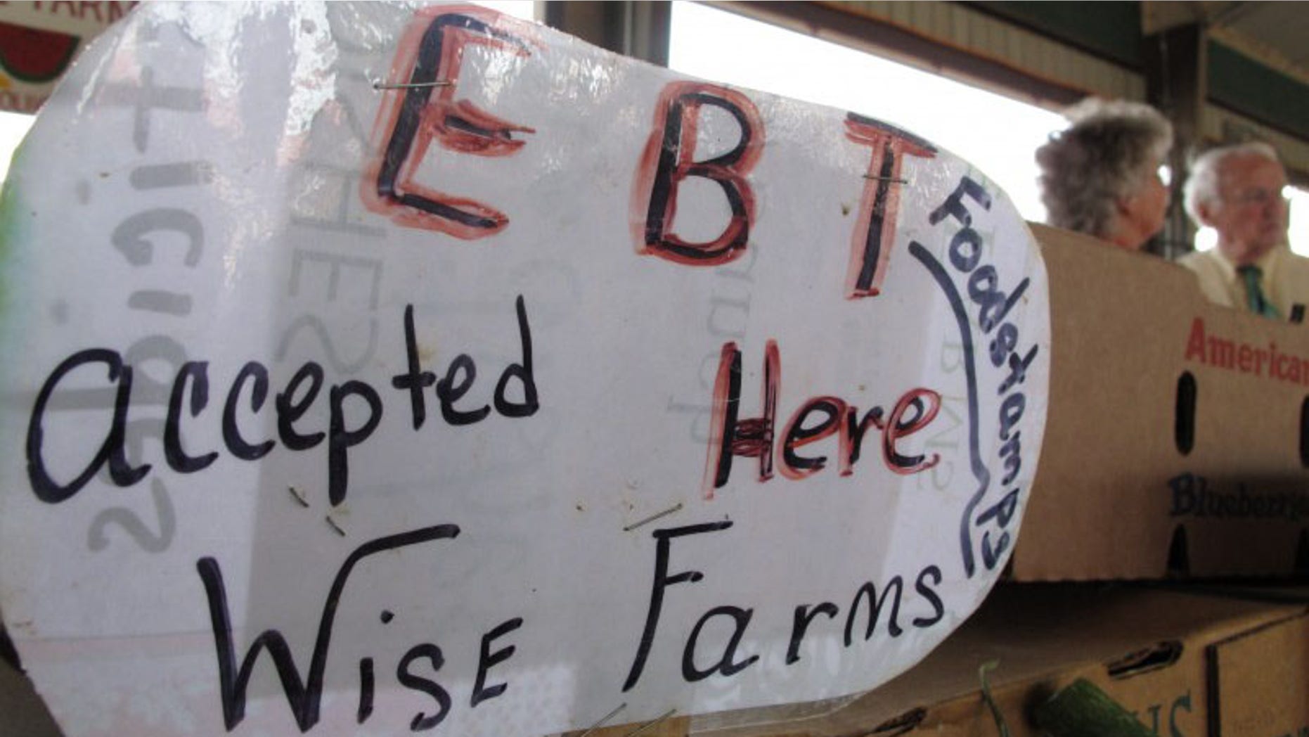 FILE: May 8, 2012: Kevin Concannon, U.S. undersecretary of Agriculture, visits a North Carolina farmers market. The feds are spending $4M million to make such markets more accessible to food stamp recipients.