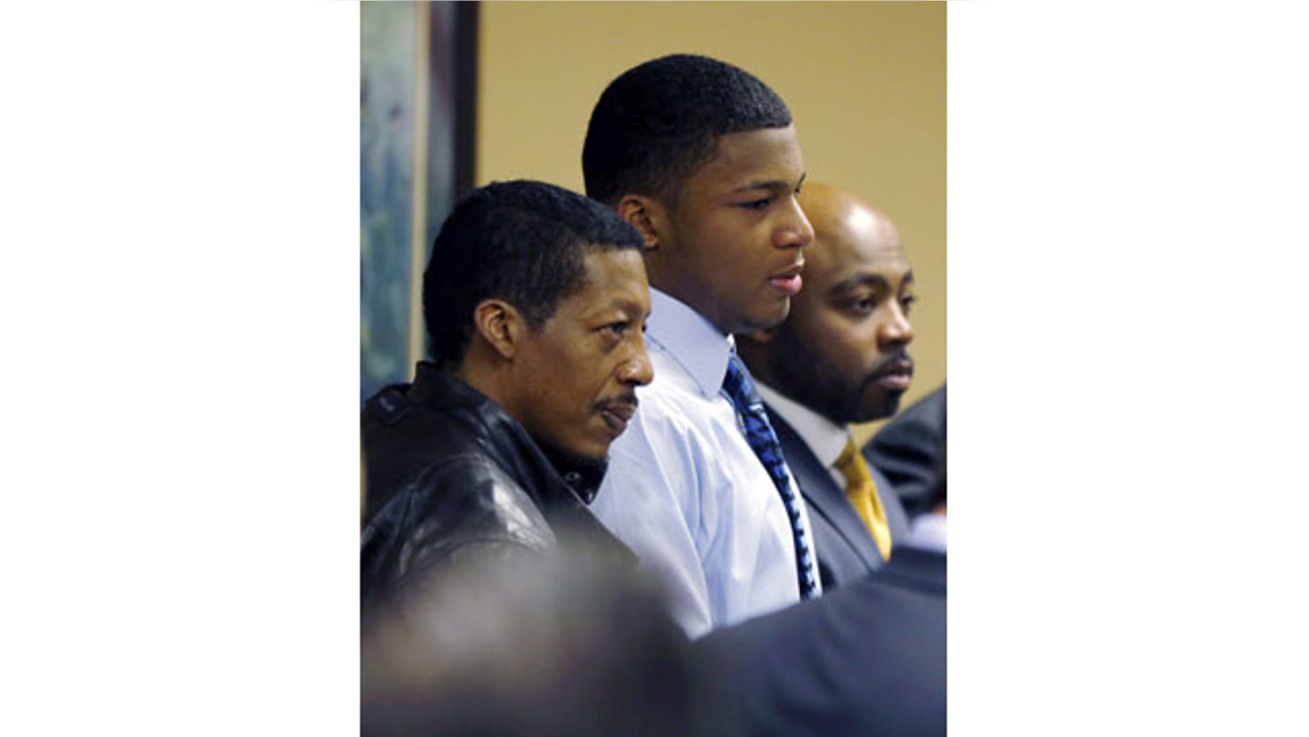 March 17, 2013: Ma'lik Richmond, center, stands with his father, Nathaniel Richmond, left, and attorney Walter Madison after he and co-defendant Trent Mays, 17, were found delinquent on rape and other charges in juvenile court in Steubenville, Ohio. (AP/File)