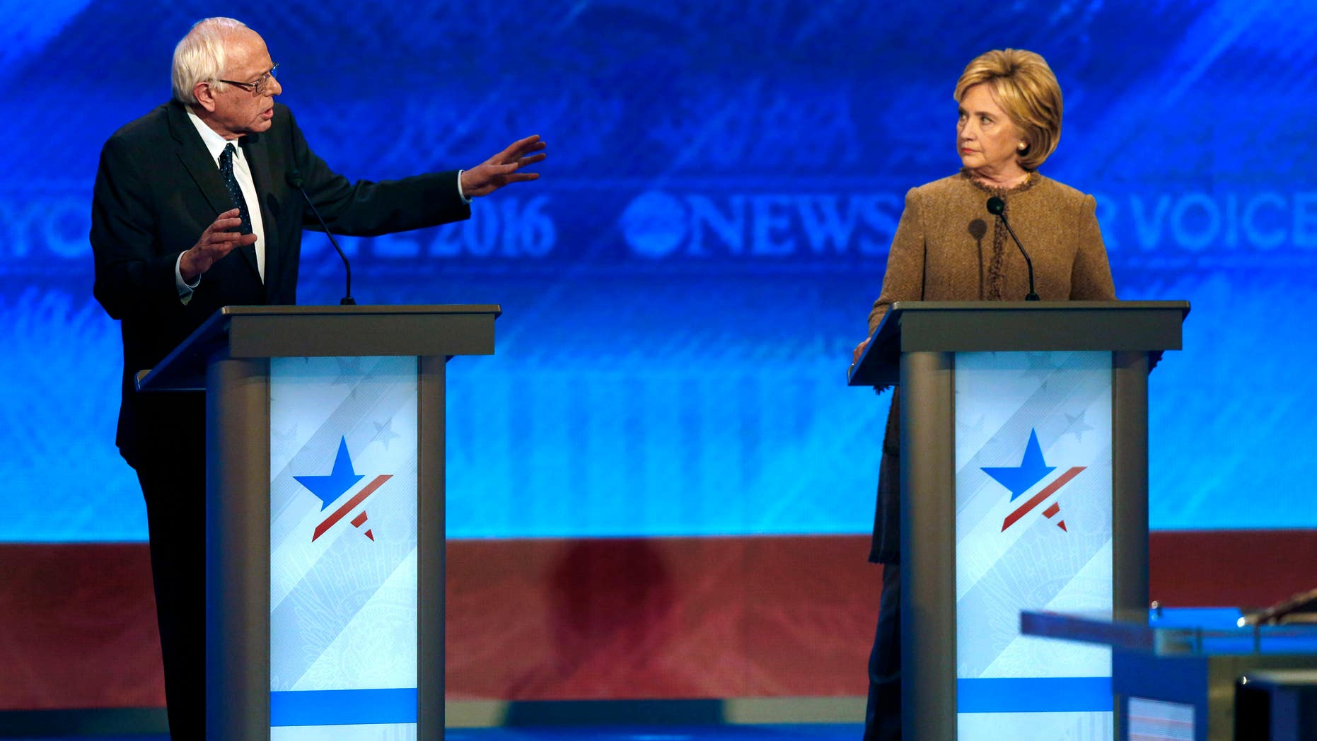 Bernie Sanders, left, offers an apology to Hillary Clinton during a Democratic presidential primary debate Saturday, Dec. 19, 2015, at Saint Anselm College in Manchester, N.H.