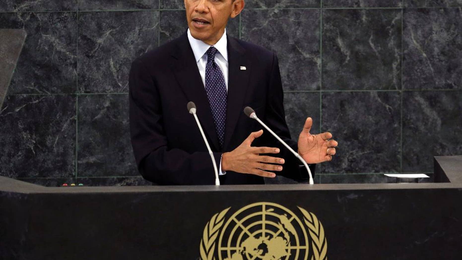 FILE - In this Sept. 24, 2013 file photo, President Barack Obama addresses the 68th session of the United Nations General Assembly. The United Nations Security Council is expected to adopt a binding resolution this week that would require nations to bar their citizens from traveling abroad to join terrorism organizations, part of a U.S.-led effort to galvanize the international community against what Obama administration officials call an "unprecedented" threat from extremists flocking to Syria and Iraq. (AP Photo/Richard Drew, File)
