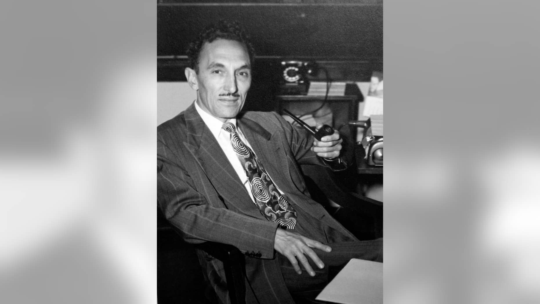 FILE - This undated image provided by Cynthia Kennedy shows pioneer Mexican American educator and activist George I. Sanchez sitting in one of his offices in N.M. Sanchez may finally get a New Mexico school named after him. An Albuquerque Public Schools committee voted Wednesday, Feb. 11, 2015 to name a new Kindergarten through 8th-grade school in honor of Sanchez in New Mexico where he was born. (AP Photo/Cynthia Kennedy, File)