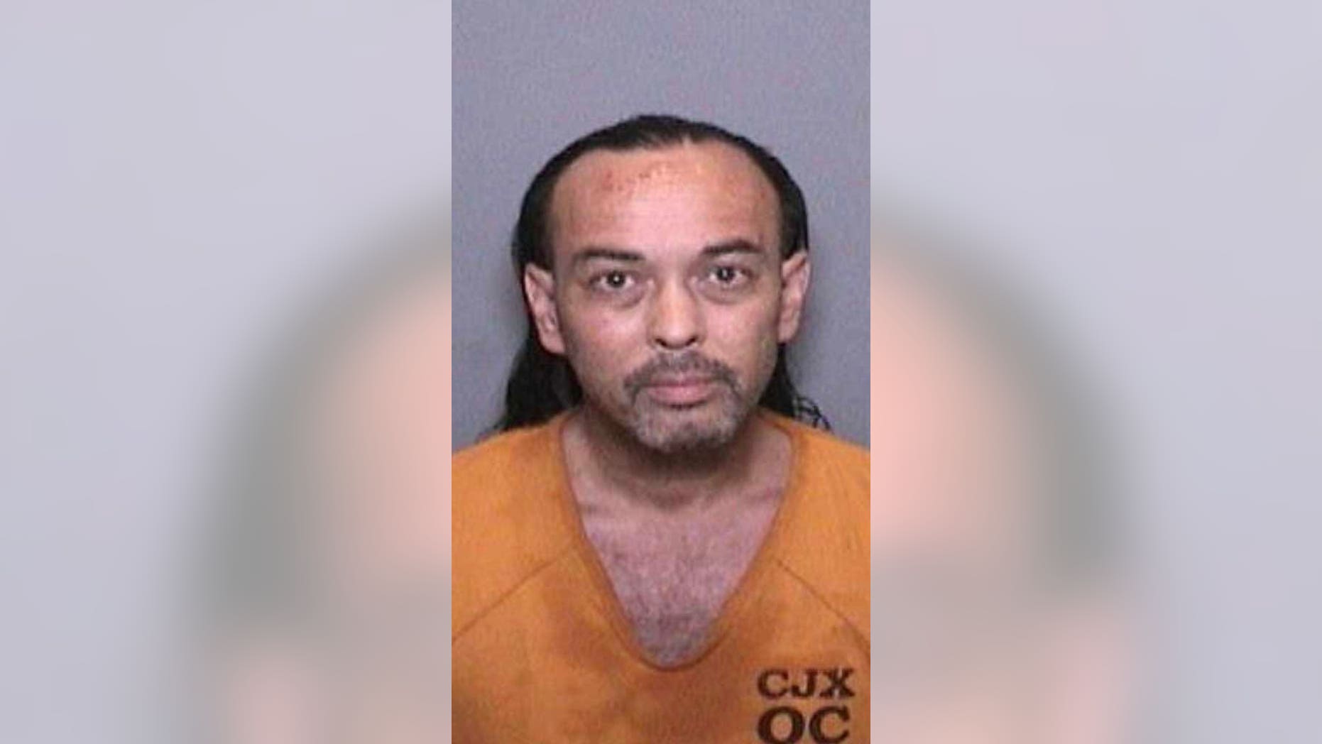 Officials at the Cleveland National Forest say 51-year-old Forrest Gordon Clark was booked Wednesday on suspicion of two counts of felony arson, and one count each of felony threat to terrorize and misdemeanor resisting arrest. (Orange County Sheriff’s Department)