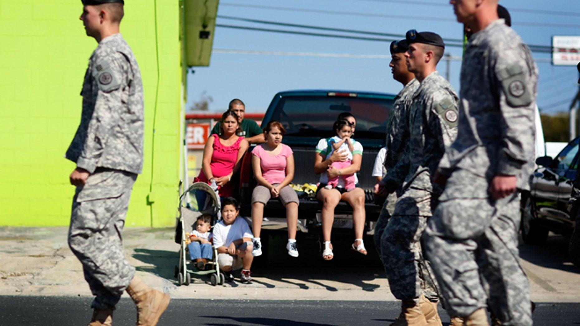 U.S. Army soldiers from Fort Hood march in a Veterans Day parade through downtown in Killeen, Texas.