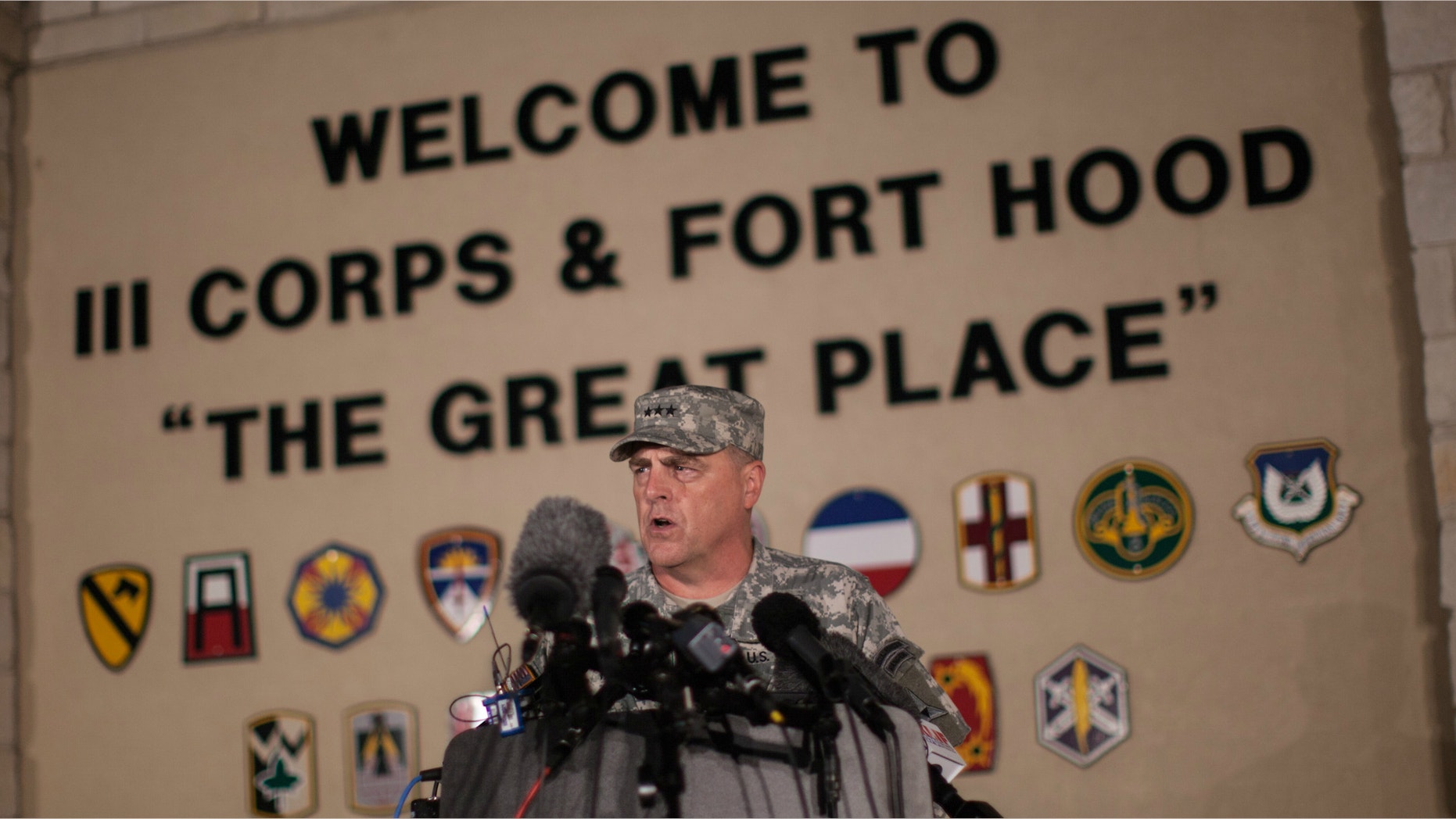 Lt. Gen. Mark Milley, commanding general of III Corps and Fort Hood, speaks with the media outside of an entrance to the Fort Hood military base following a shooting that occurred inside, Wednesday, April 2, 2014, in Fort Hood, Texas.