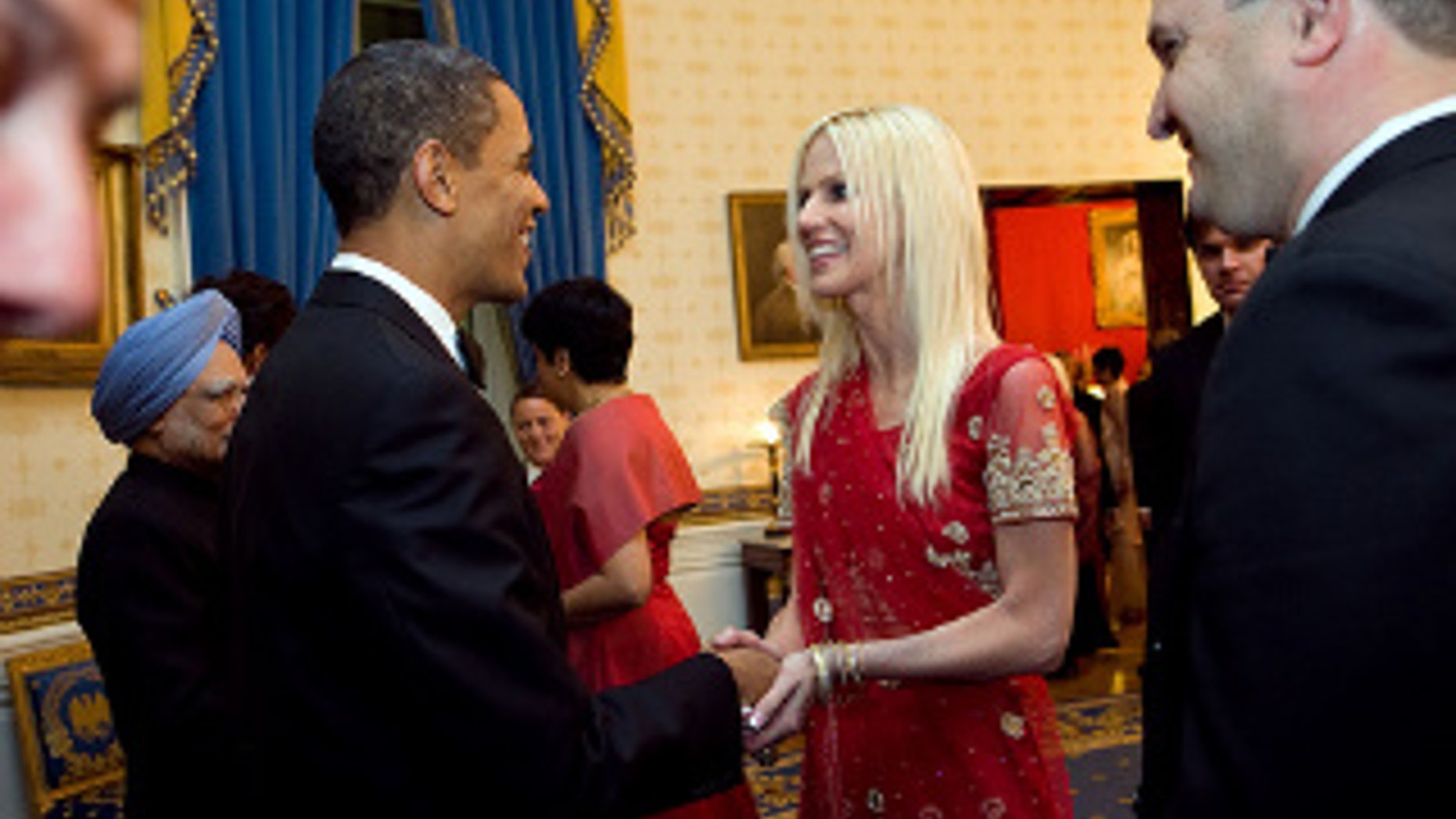President Obama greets Michaele and Tareq Salahi during a receiving line in the Blue Room of the White House before the State Dinner with Indian Prime Minister Singh, Nov. 24, 2009. (WH Photo)