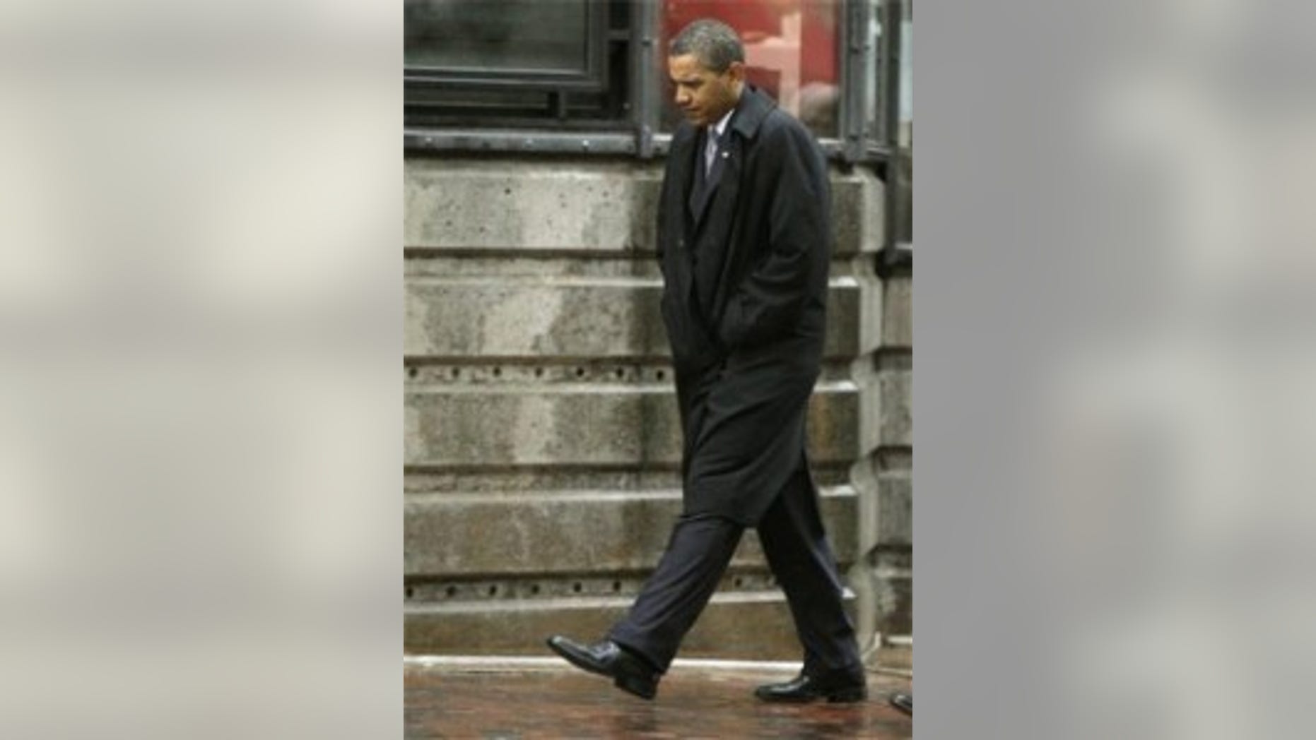 President Obama walks back to his hotel after a private meeting with Vicki Kennedy (AP Photo)