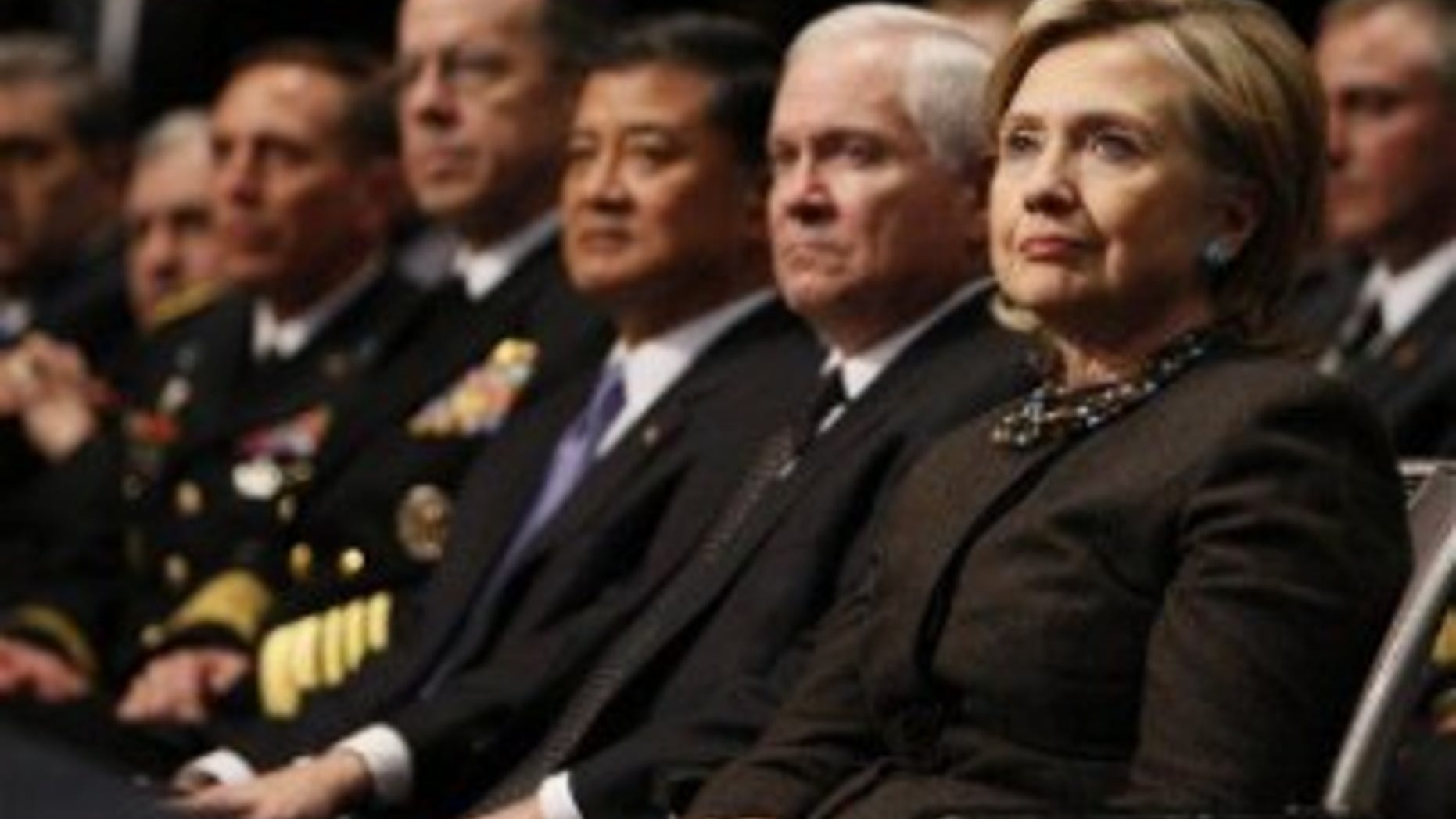 Secretary of State Hillary Clinton, right, and Defense Secretary Gates listen to President Obama's speech at U.S. Military Academy West Point (AP Photo)