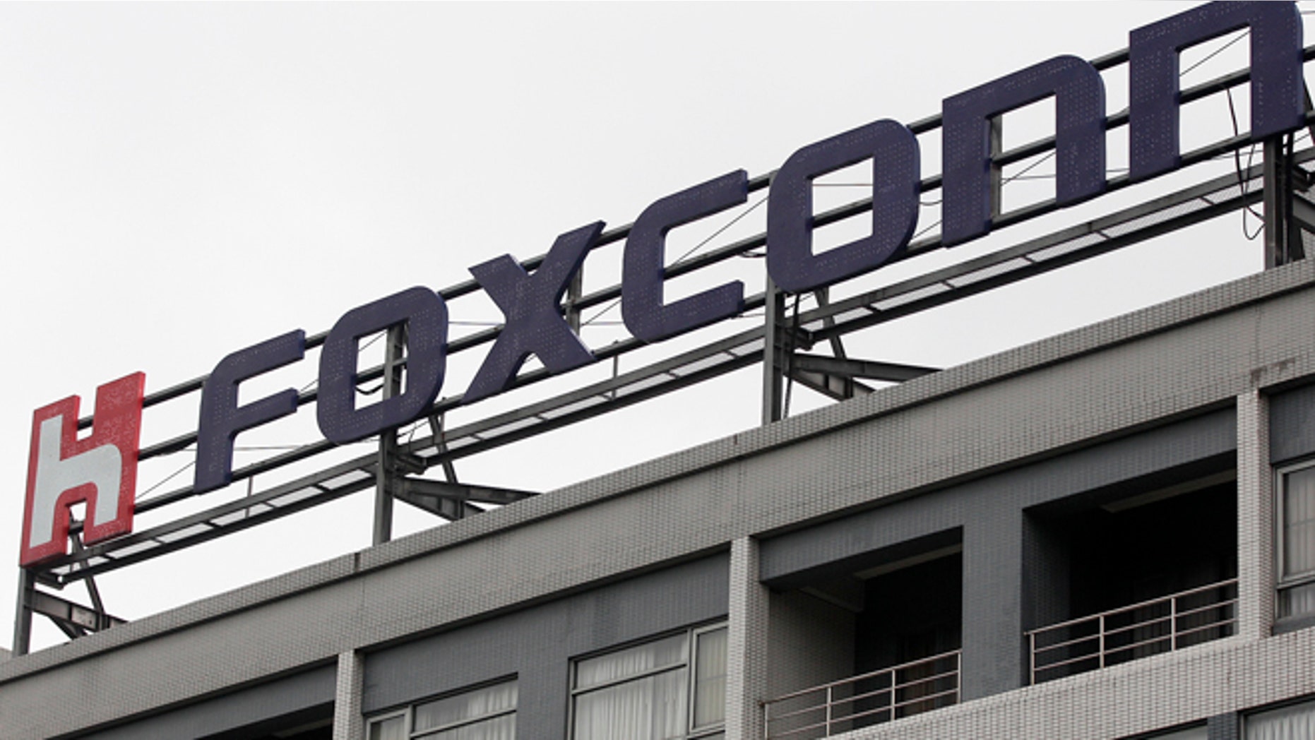 Dec. 24, 2013: The logo of Foxconn, the trading name of Hon Hai Precision Industry, is seen on top of the company's headquarters in Tucheng, New Taipei city.