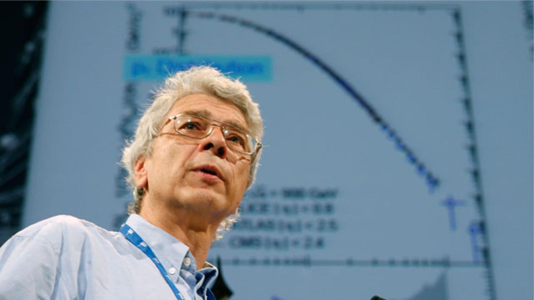 July 26: Dr. Juerg Schuknecht speaks to an audience of scientists during the 35th International Conference on High Energy Physics on the Alice experiment in Paris. International physicists announce today, some results from CERN, the European particle collider which aims at uncovering the secrets of the universe, and how the universe began. (AP)