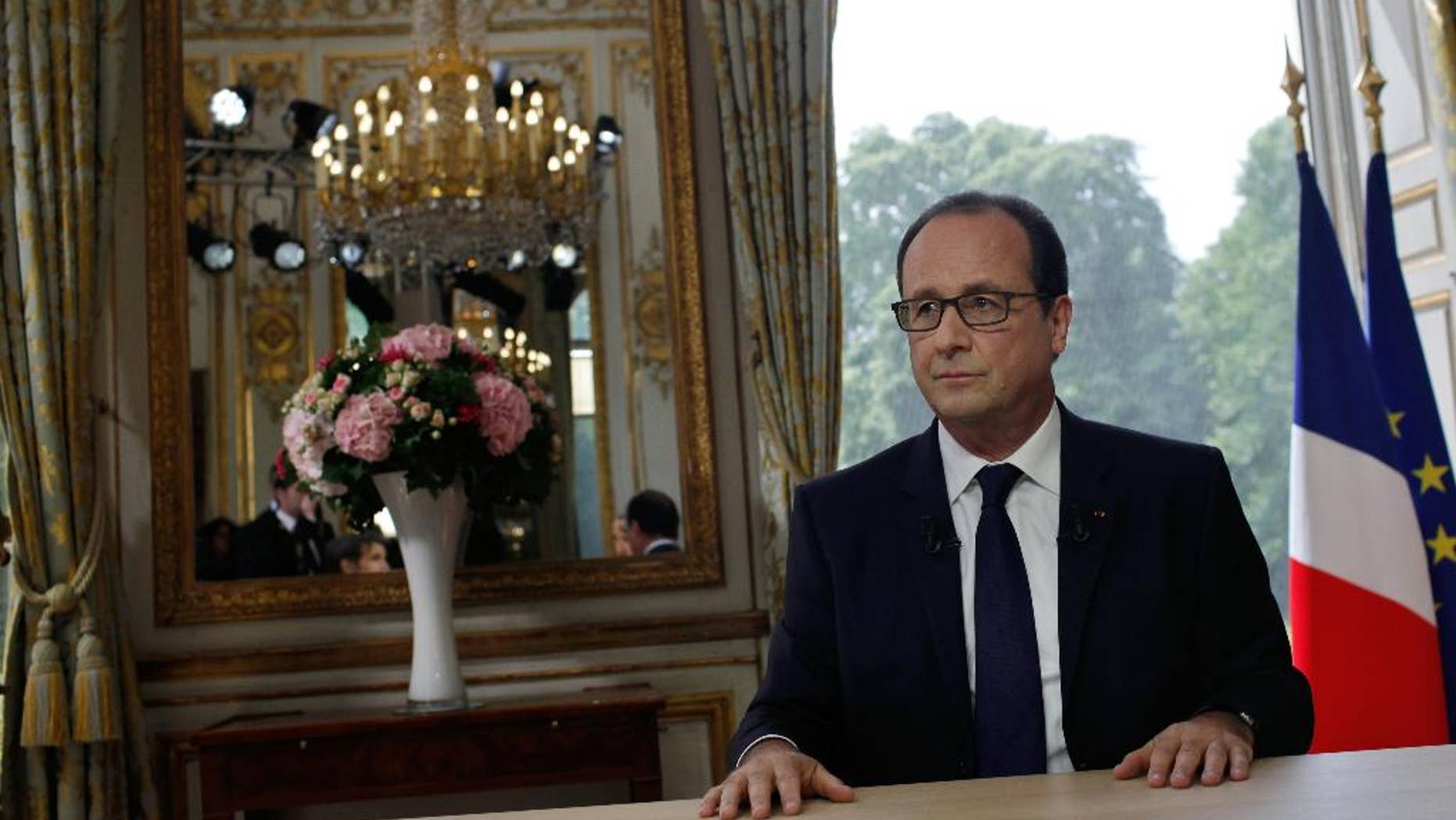France's President Francois Hollande after the traditional interview following the bastille day parade, at the Elysee Palace, in Paris, Monday, July 14, 2014. Hollande is urging partners to talk to Hamas and is pressing Israel for calm in hopes of reaching a cease-fire in Gaza. (AP Photo/Thibault Camus, Pool)