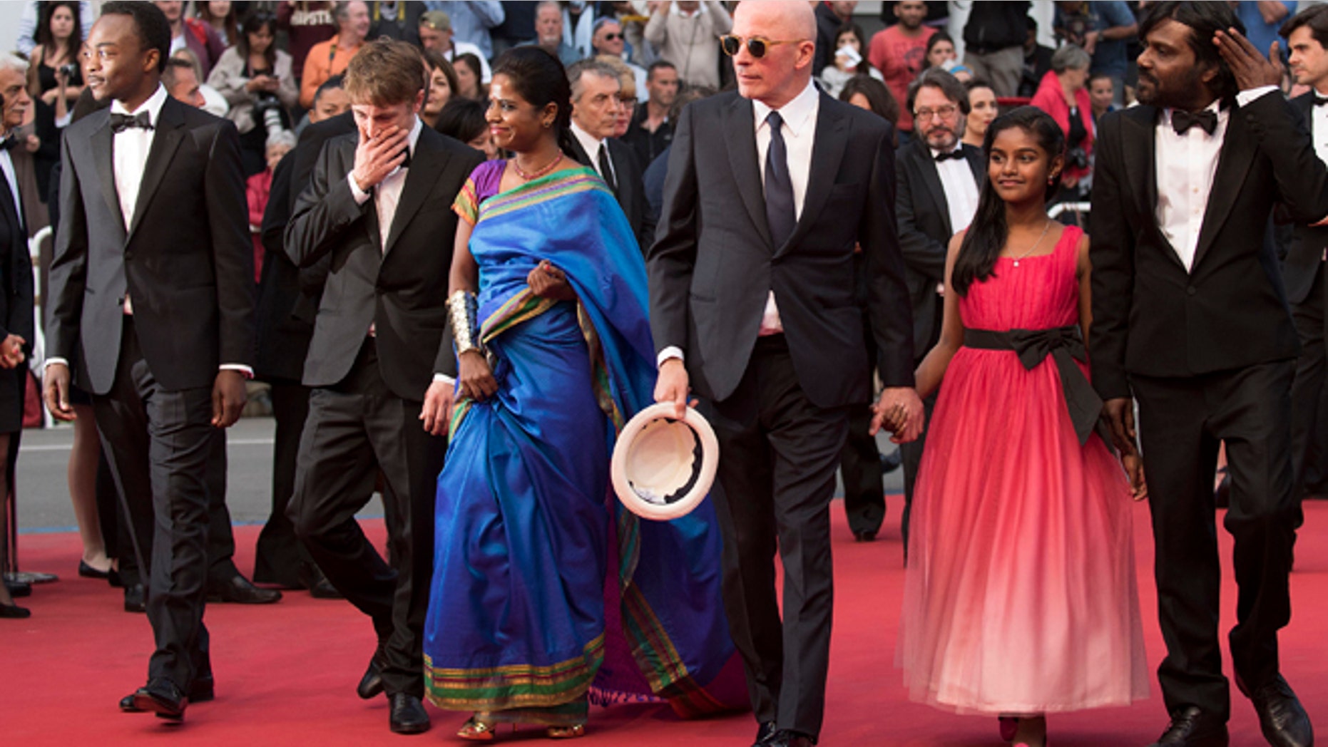 May 21, 2015: From left, Marc Zinga, Vincent Rottiers, Kalieaswari Srinivasan, director Jacques Audiard, Claudine Vinasithamby and Jesuthasan Antonythasan arrive for the screening of the film Dheepan at the 68th international film festival, Cannes, southern France.