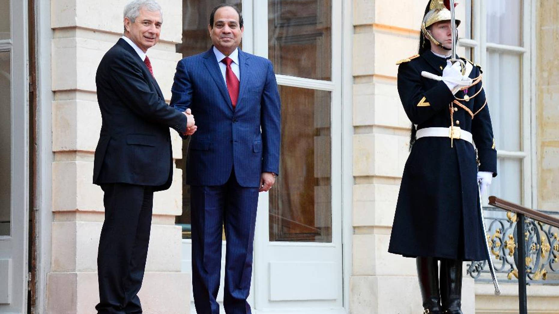 French National Assembly President Claude Bartolone, left, welcomes Egyptian President Abdel-Fattah el-Sissi before their talks in Paris, France, Thursday Nov. 27 Nov. 2014. Sissi ends his two-day visit to France. (AP Photo/Bertrand Guay, Pool)