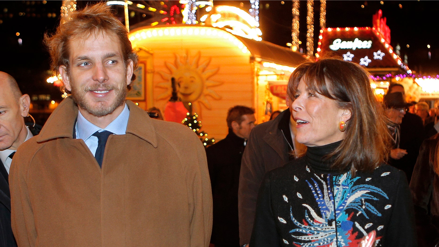 Princess Caroline of Hanover, right, and her eldest son Andrea Casiraghi, attend the opening of the Christmas village in Monaco, in this file photo dated Wednesday, Dec. 5, 2012. A baby boy is the latest addition to this jet set royal family, it is announced Friday March 22, 2013, born to Andrea Casiraghi and his Colombian fiancee heiress Tatiana Santo Domingo. Mother and child are understood to be in good health. (AP Photo/Lionel Cironneau, file)