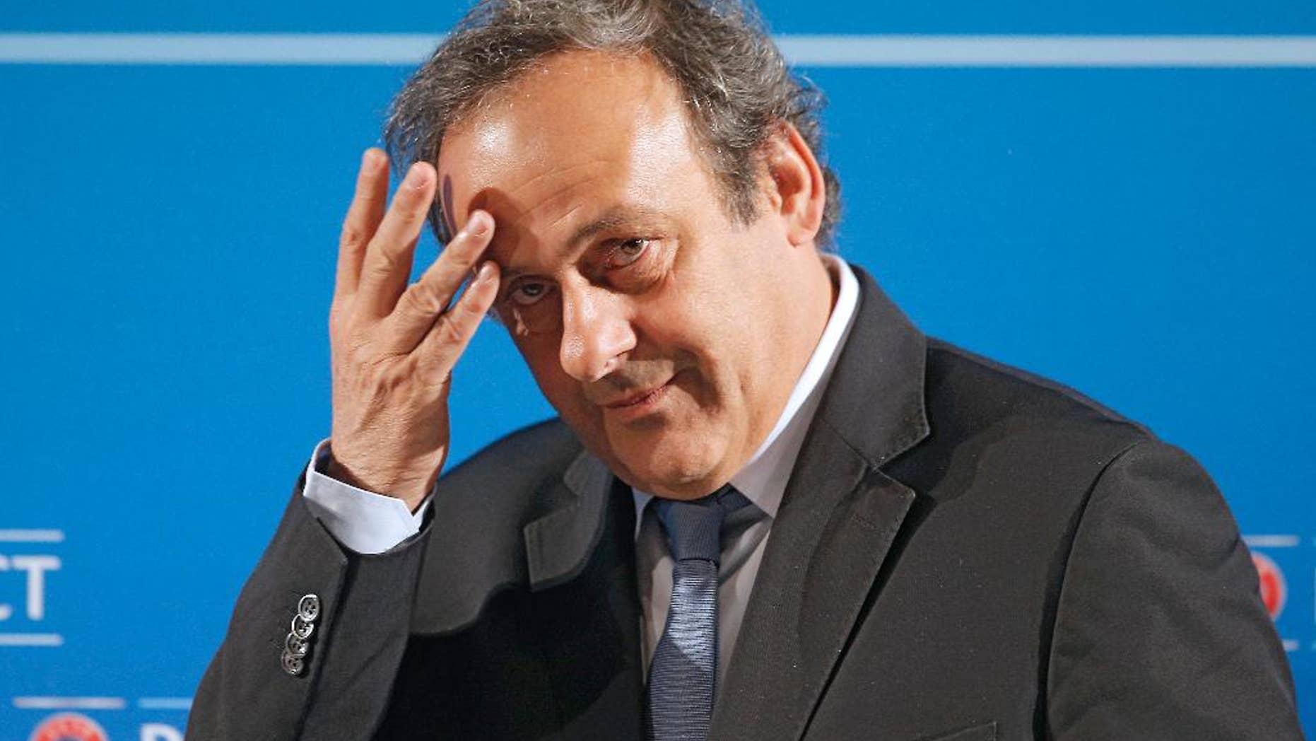 FILE - In this Feb.22, 2014 file photo, UEFA President Michel Platini arrives at a press conference, one day prior to the UEFA EURO 2016 qualifying draw in Nice, southeastern France. Michel Platini will not challenge Sepp Blatter for the FIFA presidency, saying Thursday Aug.28, 2014 there was "no shadow of doubt" about his decision. The former France great was expected to avoid a contest against Blatter after a successful World Cup strengthened the FIFA president's position. (AP Photo/Lionel Cironneau, File)