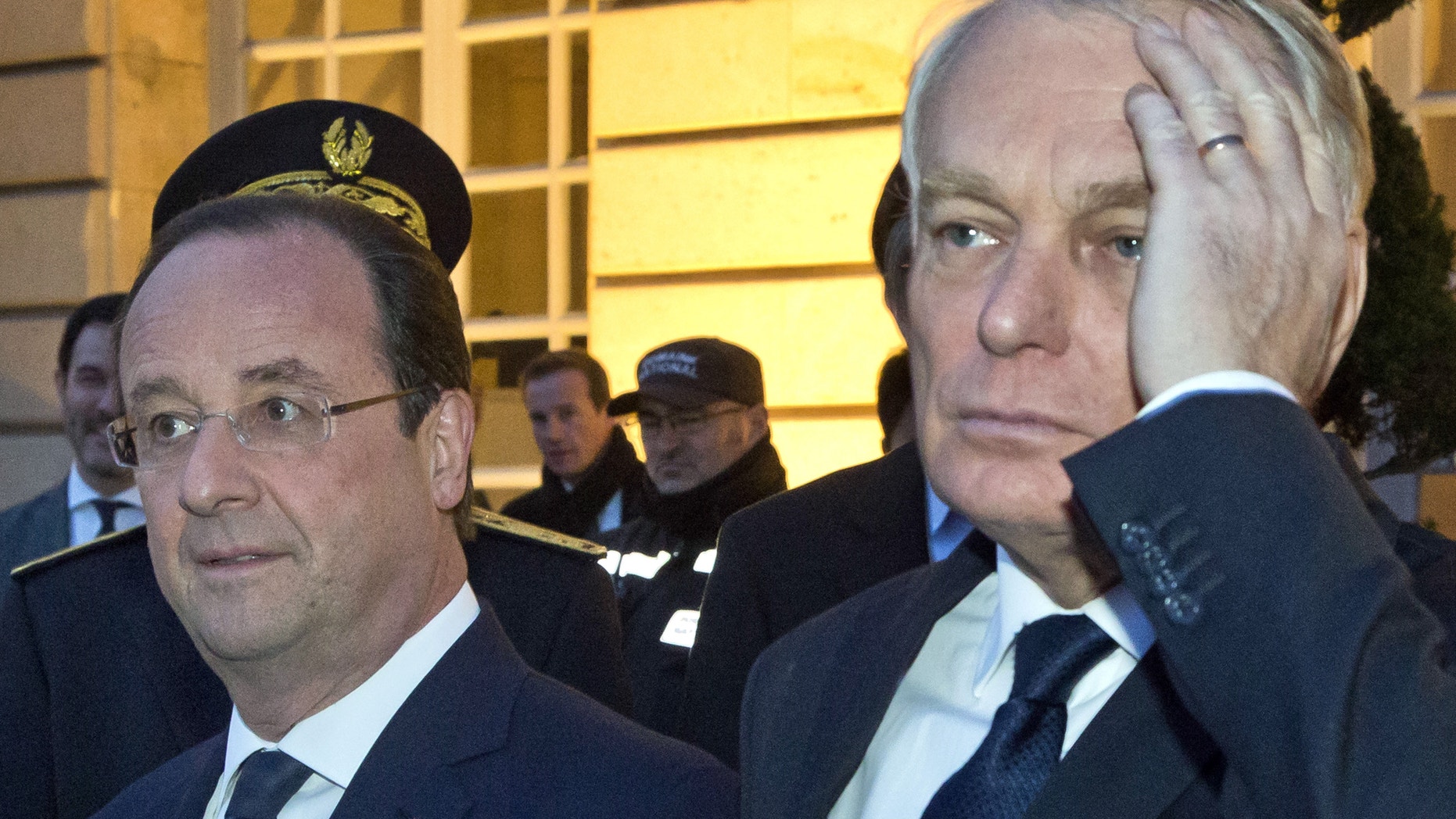 March 27, 2014 - FILE photo- French President Francois Hollande, left, and French Prime Minister Jean-Marc Ayrault, right, at the Chateau de Versailles, west of Paris.