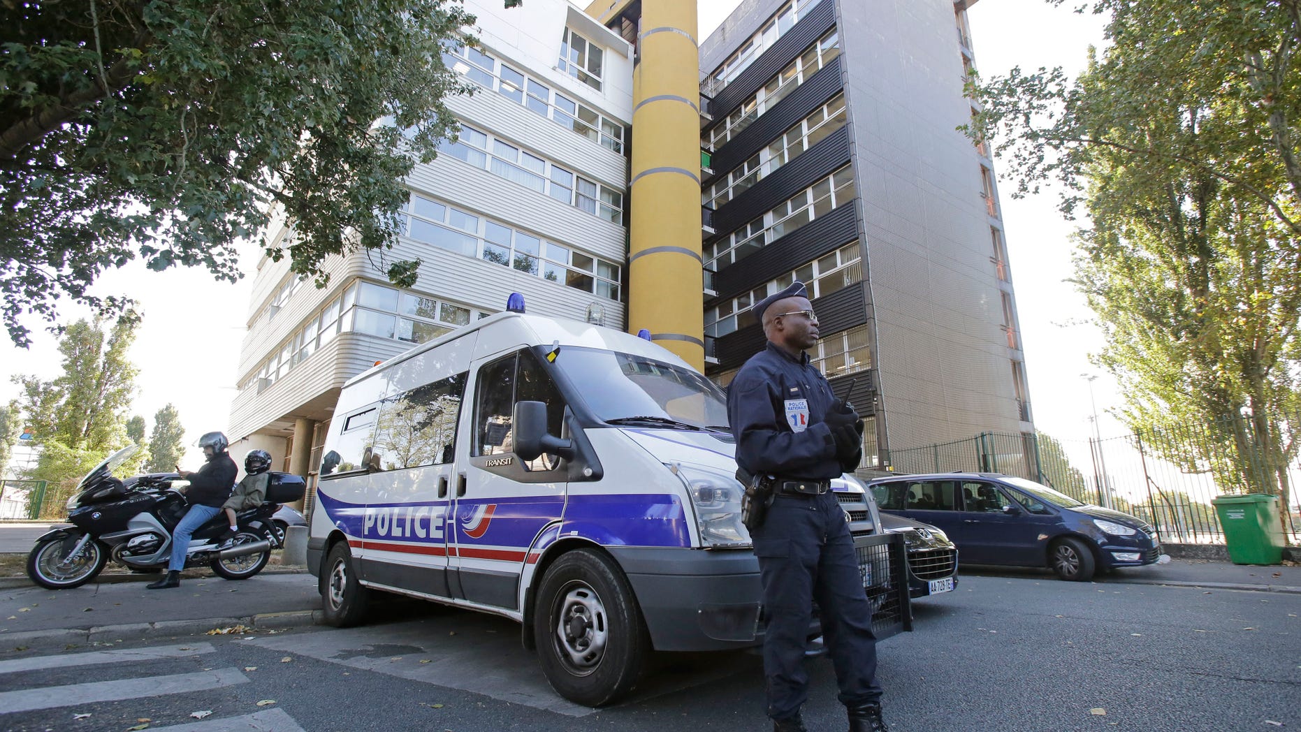 A French policeman stands guard outside the headquarters of the satirical weekly Charlie Hebdo in Paris.