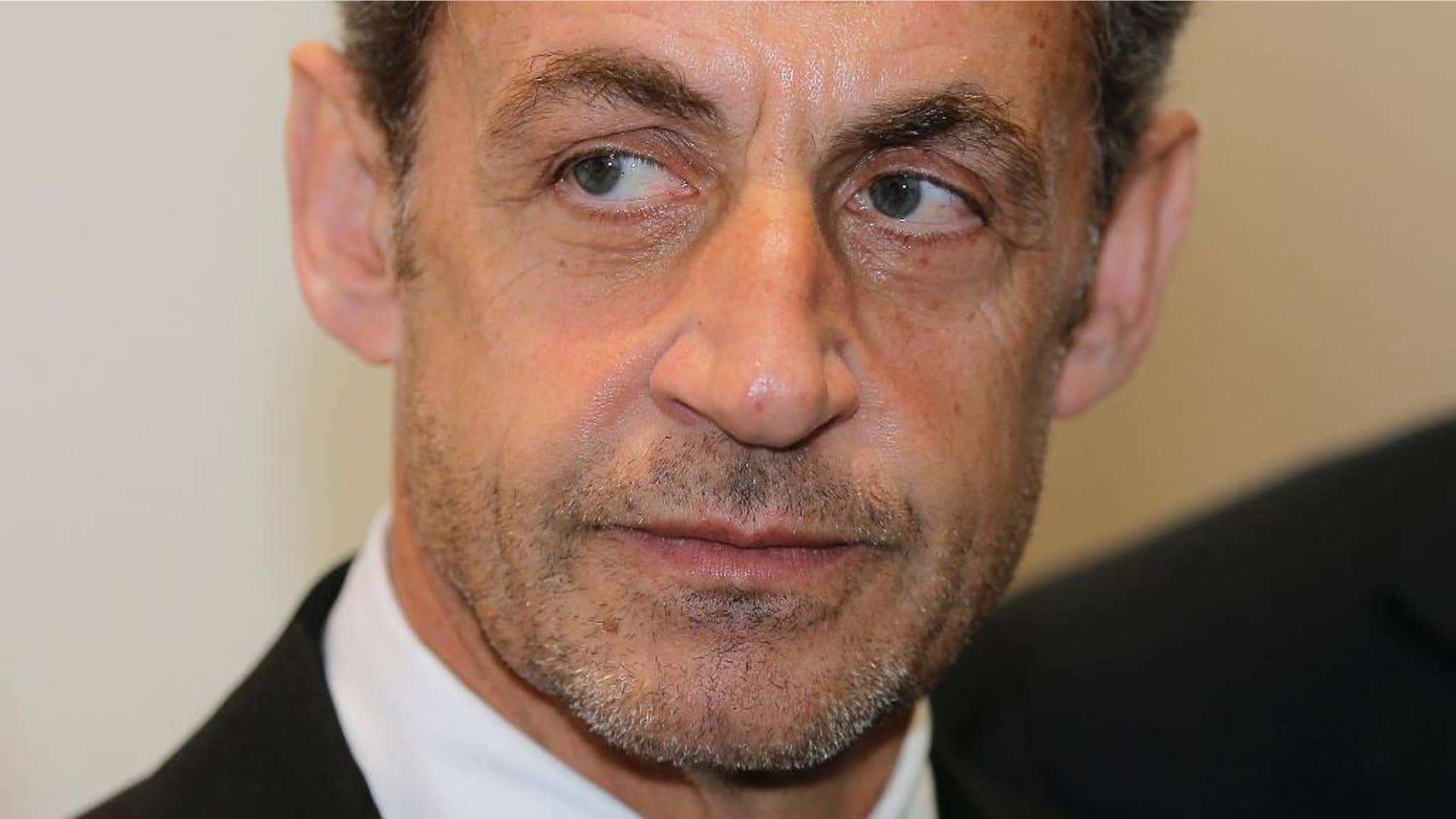 FILE - This Monday, March 10, 2014, file photo shows former French President Nicolas Sarkozy at the Foundation Claude Pompidou, in Nice, French Riviera. Former French President Nicolas Sarkozy has been detained and is reportedly being questioned by financial investigators in a corruption probe that is rattling France’s conservative political establishment. (AP Photo/Lionel Cironneau, File)