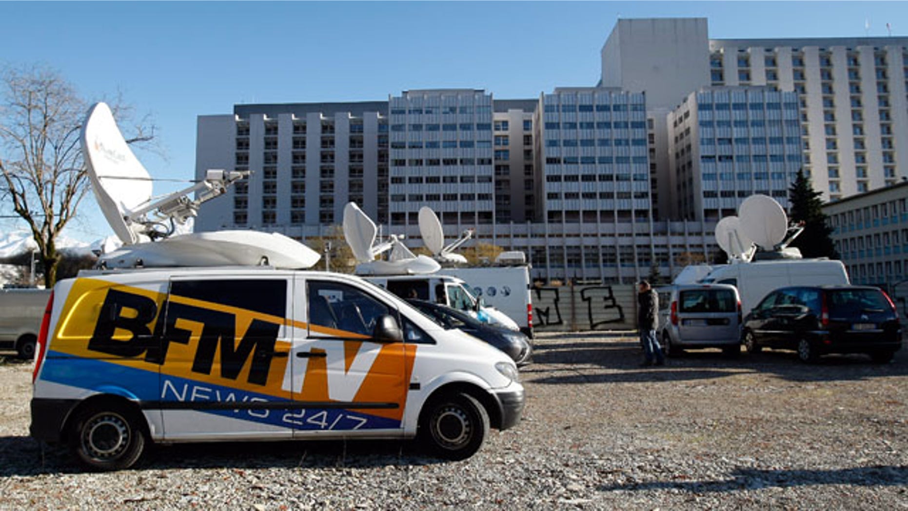 January 5, 2014: A TV van is parked in front of the Grenoble hospital where former seven-time Formula One champion Michael Schumacher is being treated after sustaining a head injury during a ski accident. (AP Photo/Claude Paris)