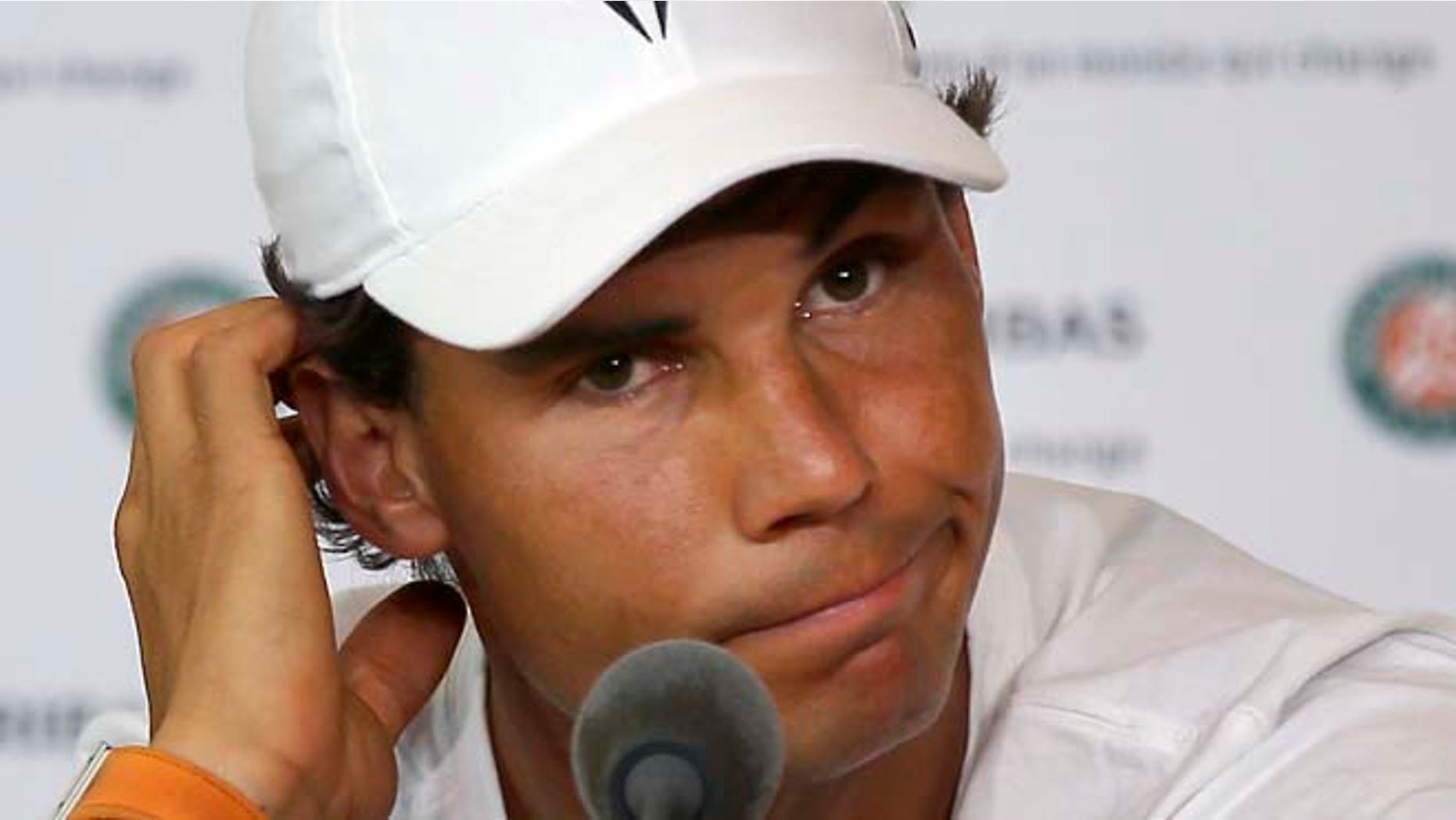 Nine-time champion Rafael Nadal announces he is pulling out of the French Open because of an injury to his left wrist during a press conference at the Roland Garros stadium in Paris, France, Friday, {map} 27, 2016. The left-handed Nadal made the announcement at a hastily arranged news conference Friday, one day before he would have been scheduled to play his third-round match. (AP Photo/Michel Euler)