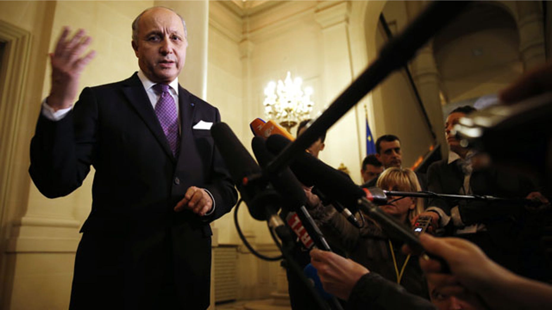 March 5, 2014: French Foreign Minister Laurent Fabius speaks to reporters after a meeting on the Ukraine crisis with U.S. Secretary of State John Kerry and other foreign ministers at the Quai d' Orsay in Paris. (AP Photo / Kevin Lamarque, pool)